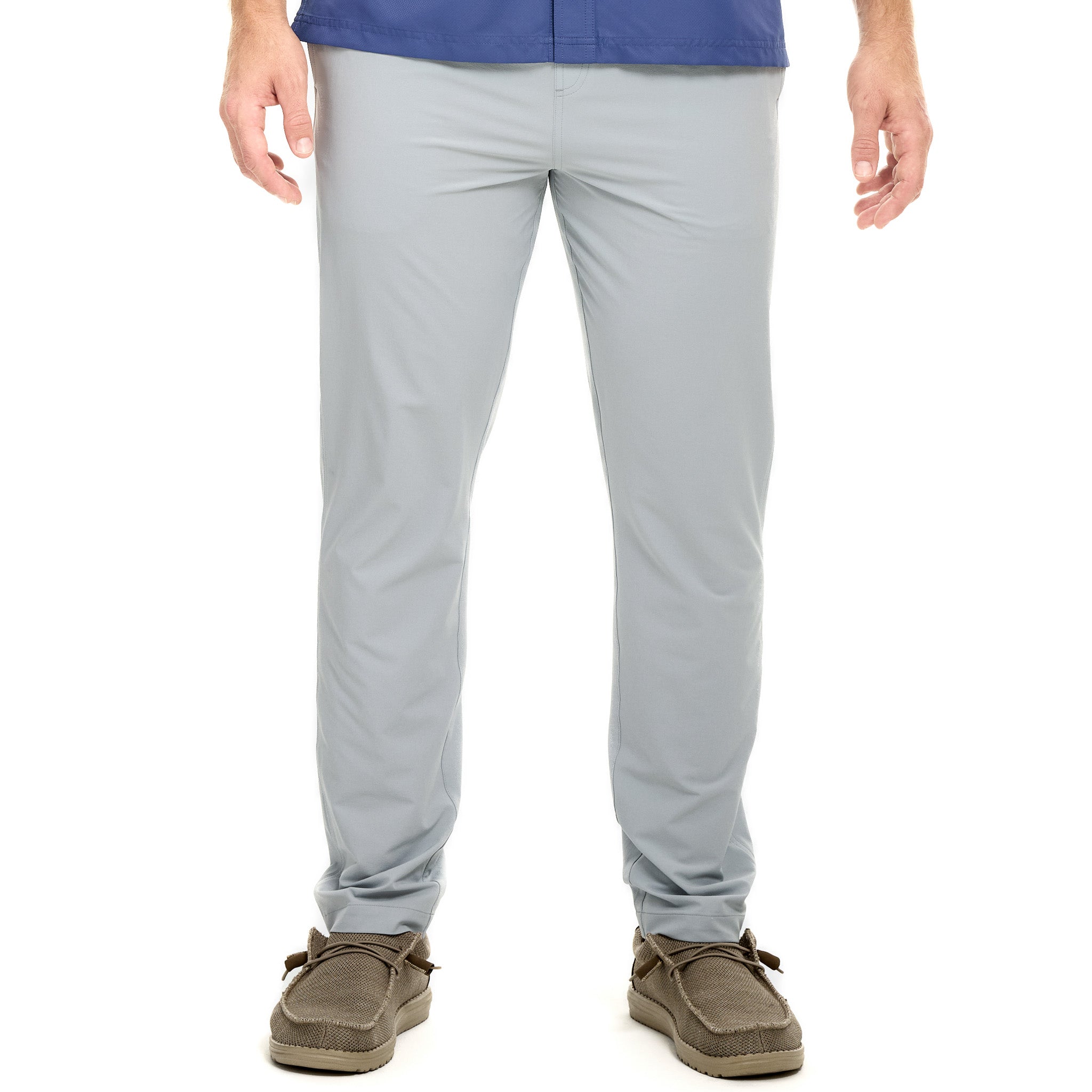 Person wearing light gray pants on a white background