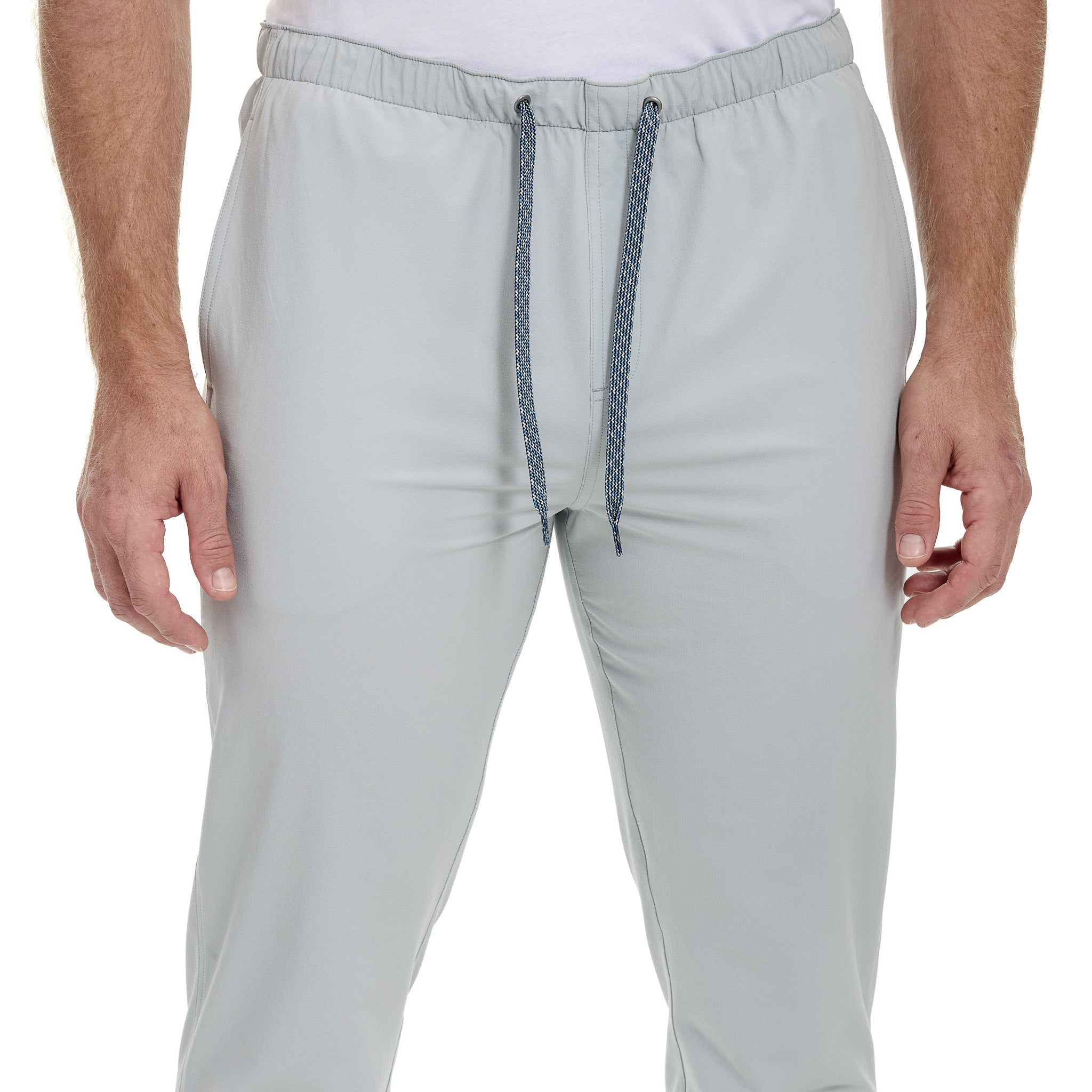 Light gray jogger pants with a drawstring on a white background