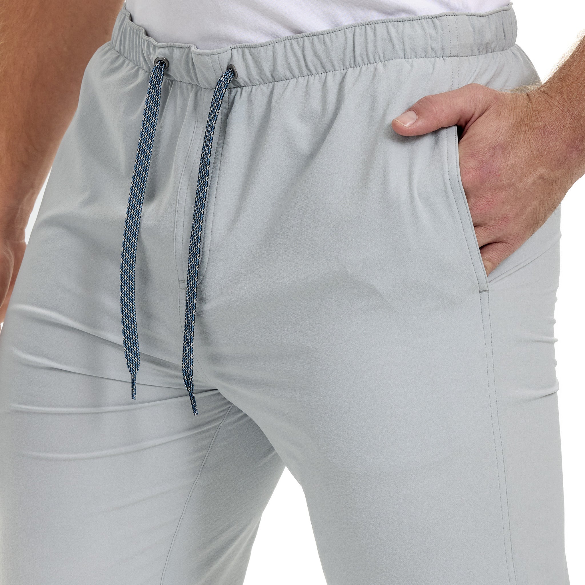 Light gray jogger pants with a drawstring on a white background