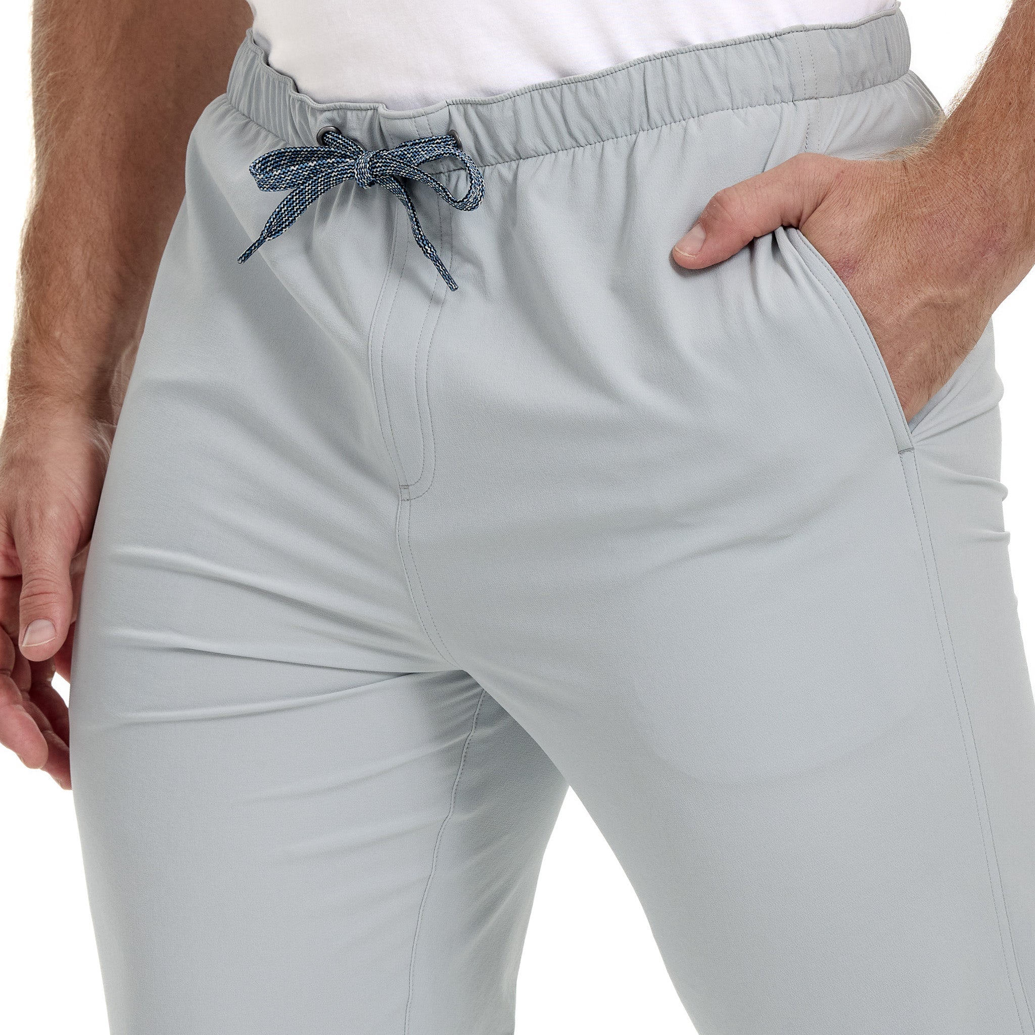 Light gray pants with a drawstring on a white background