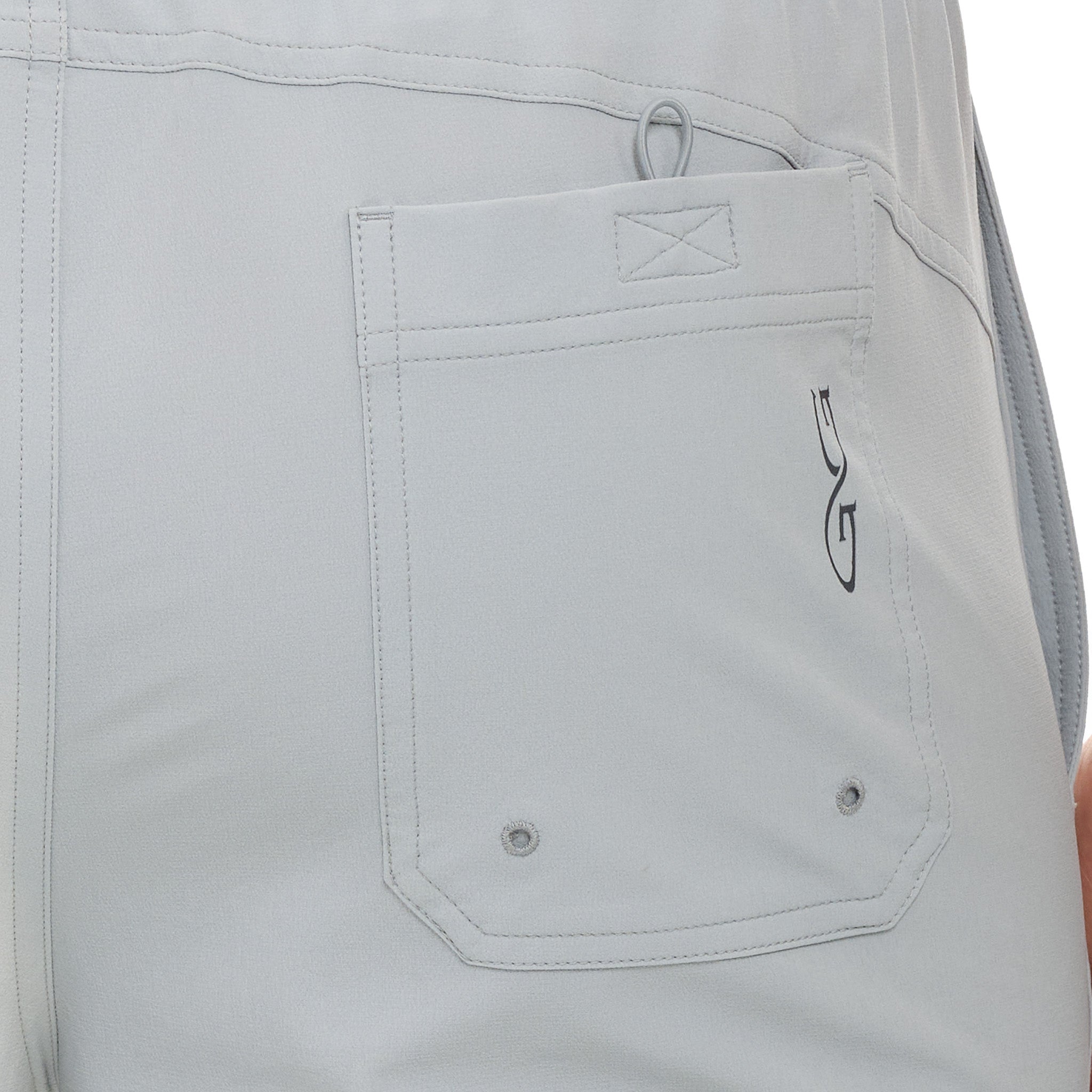 Close-up of a gray pocket with a brand logo on a white background