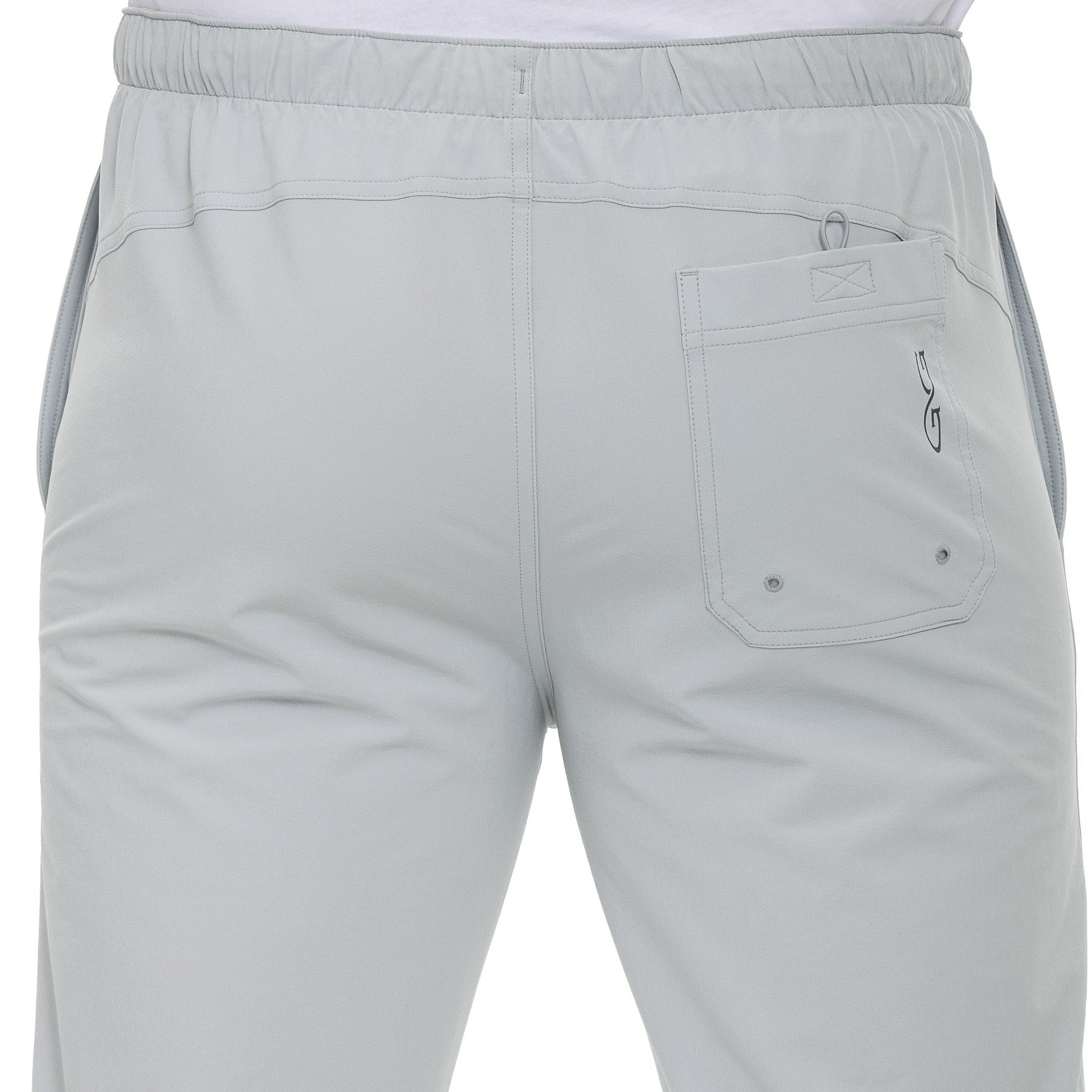 Light gray pants with a brand logo on a white background