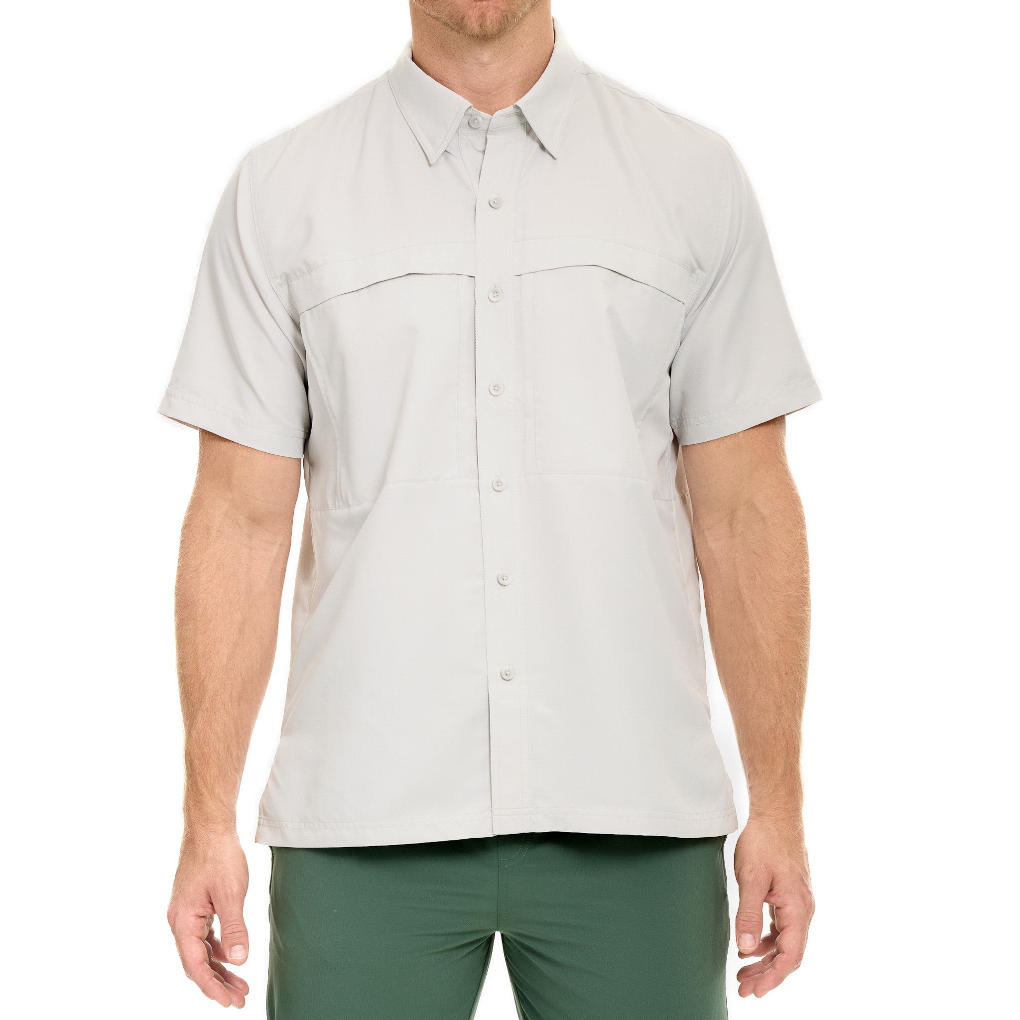 Man wearing a light gray short-sleeve button-up shirt and green pants on a white background