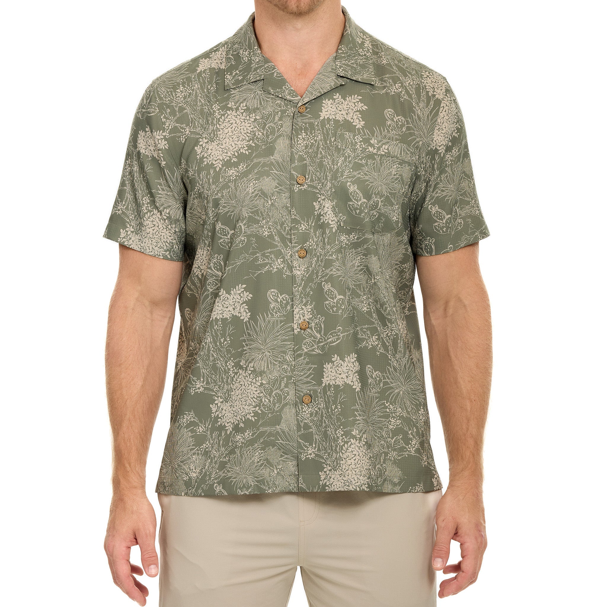 Man wearing a green patterned shirt on a white background
