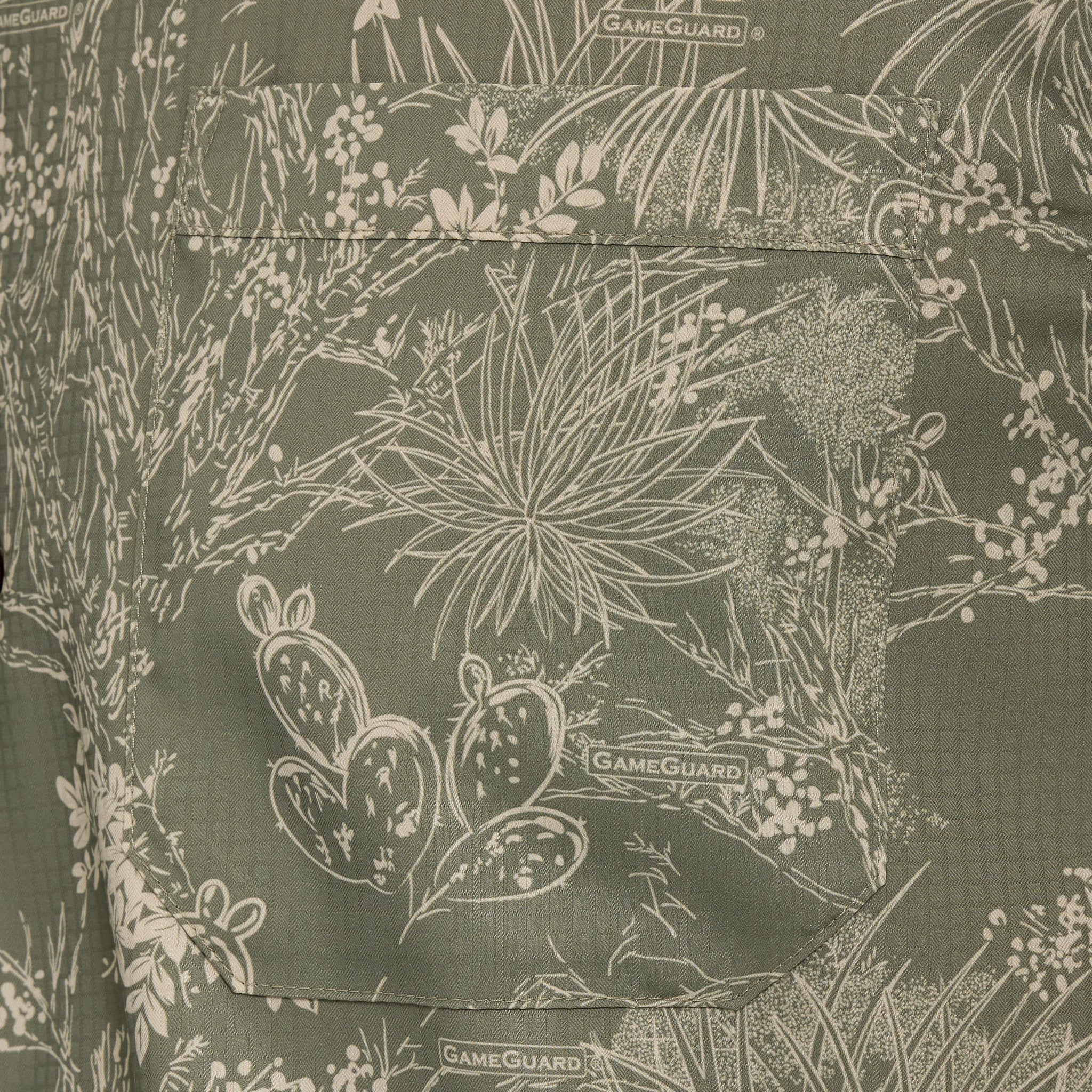 Green fabric with nature-themed pattern and 'GameGuard' branding.