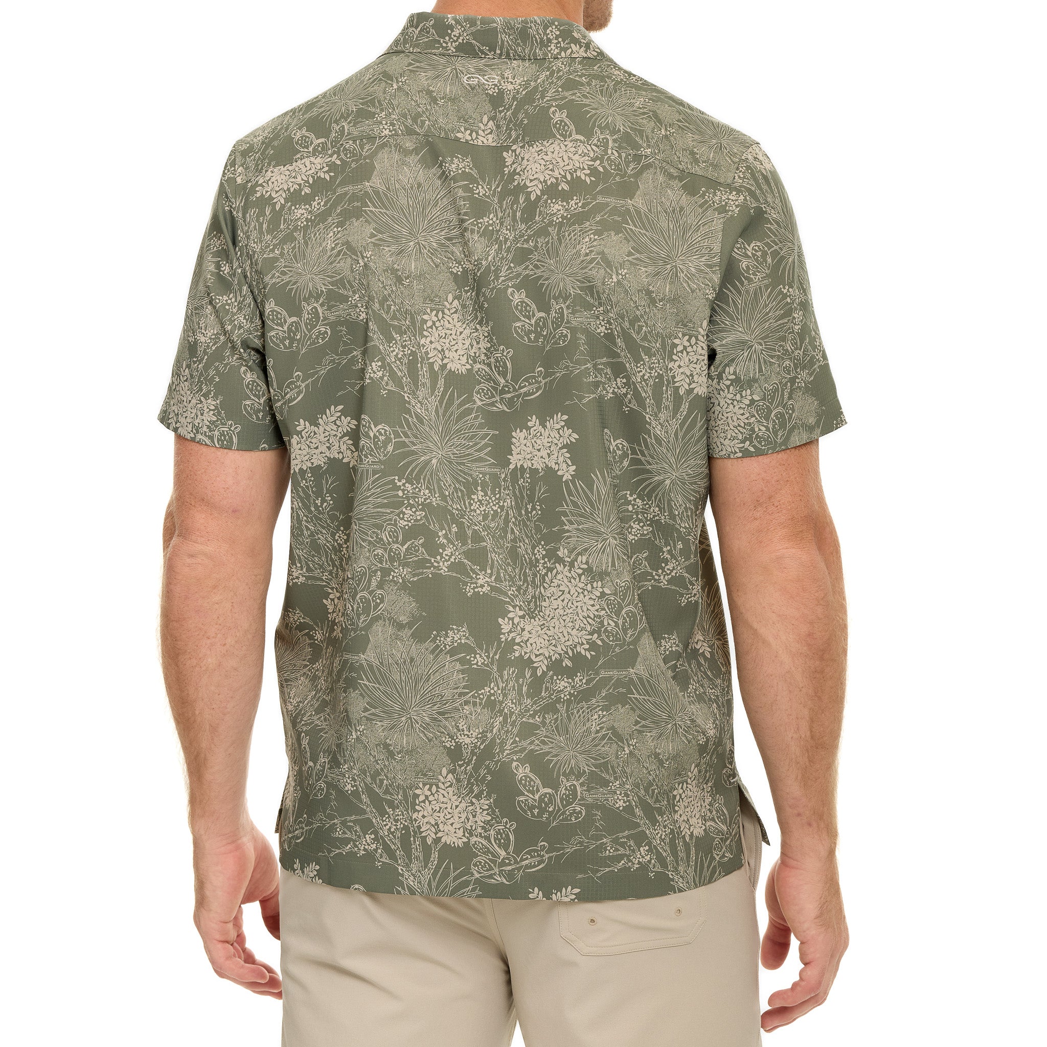 Man wearing a green floral patterned shirt on a white background