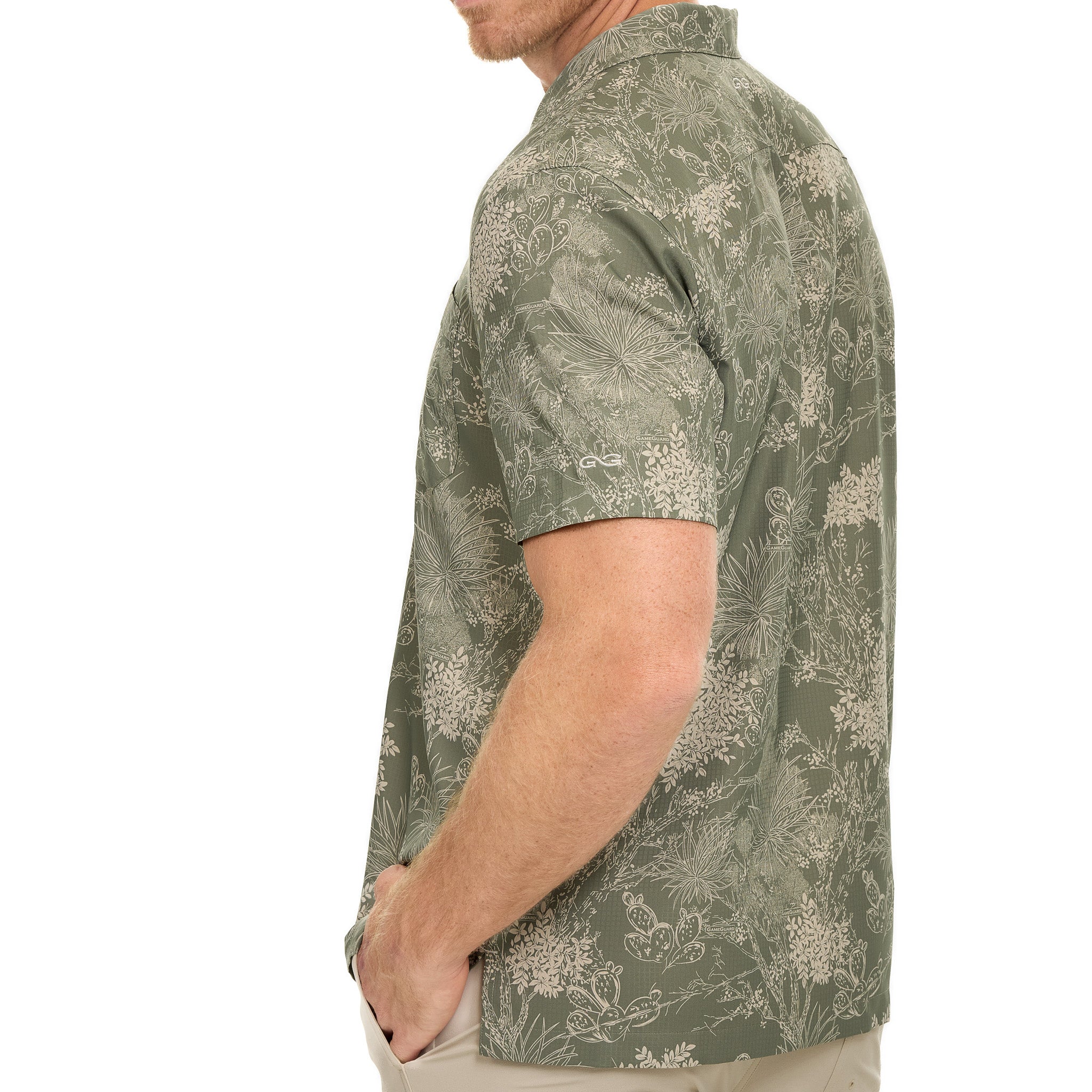 Man wearing a green patterned shirt on a white background