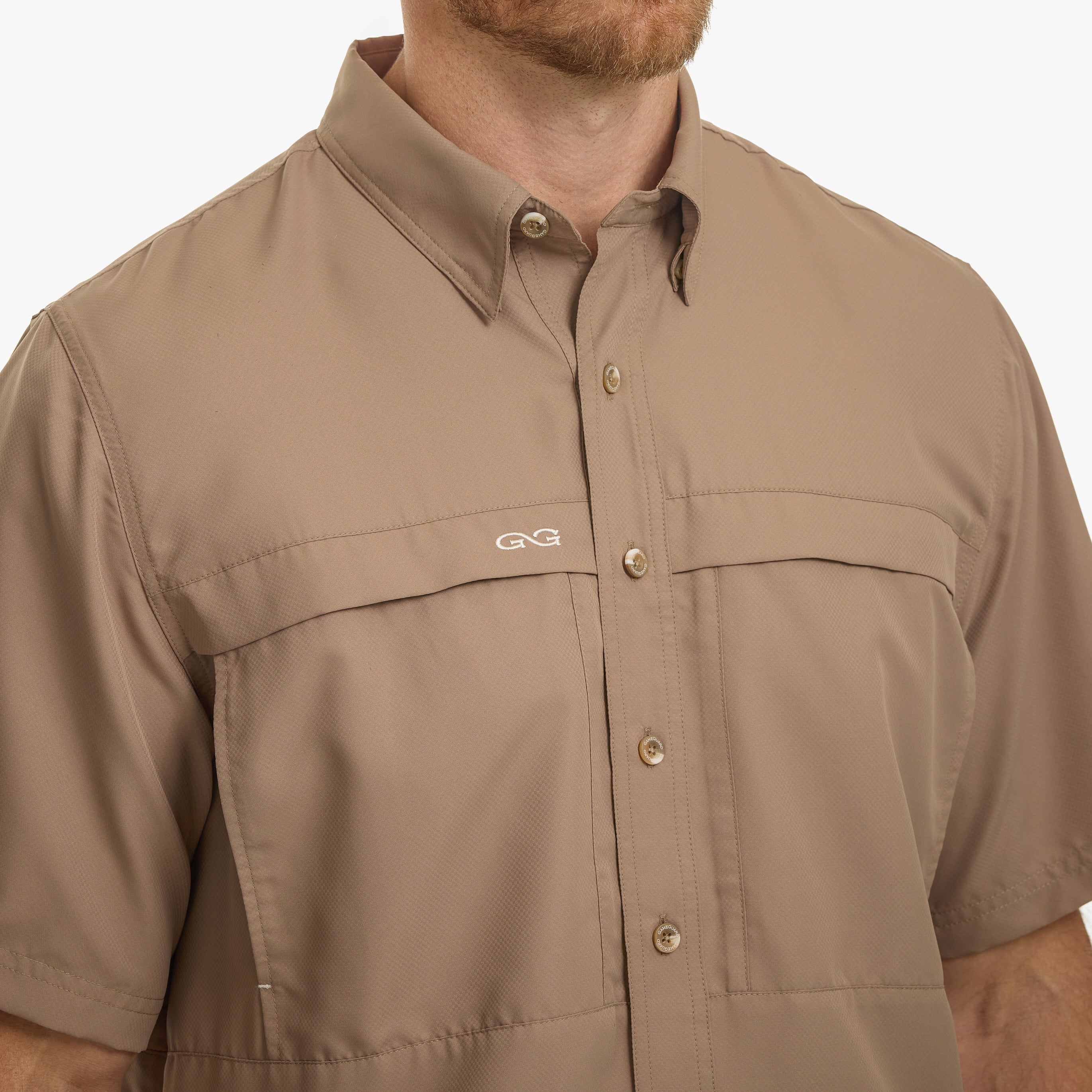 Brown short-sleeve shirt with a brand logo on a white background