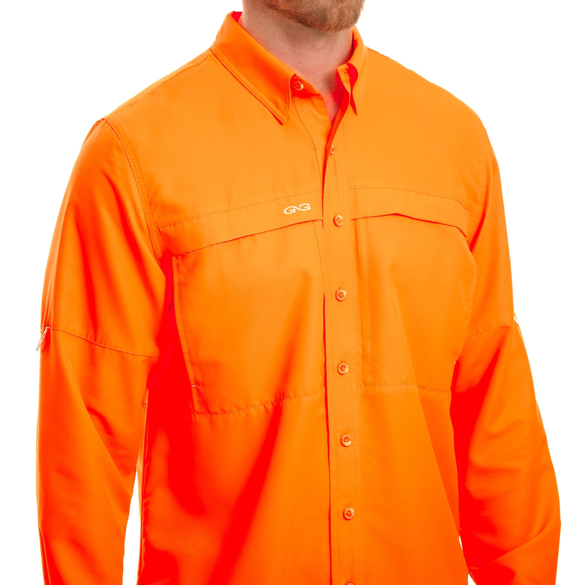 A bright orange long-sleeve button-up shirt with two chest pockets and a small embroidered logo on the left chest, shown on a model against a white background.