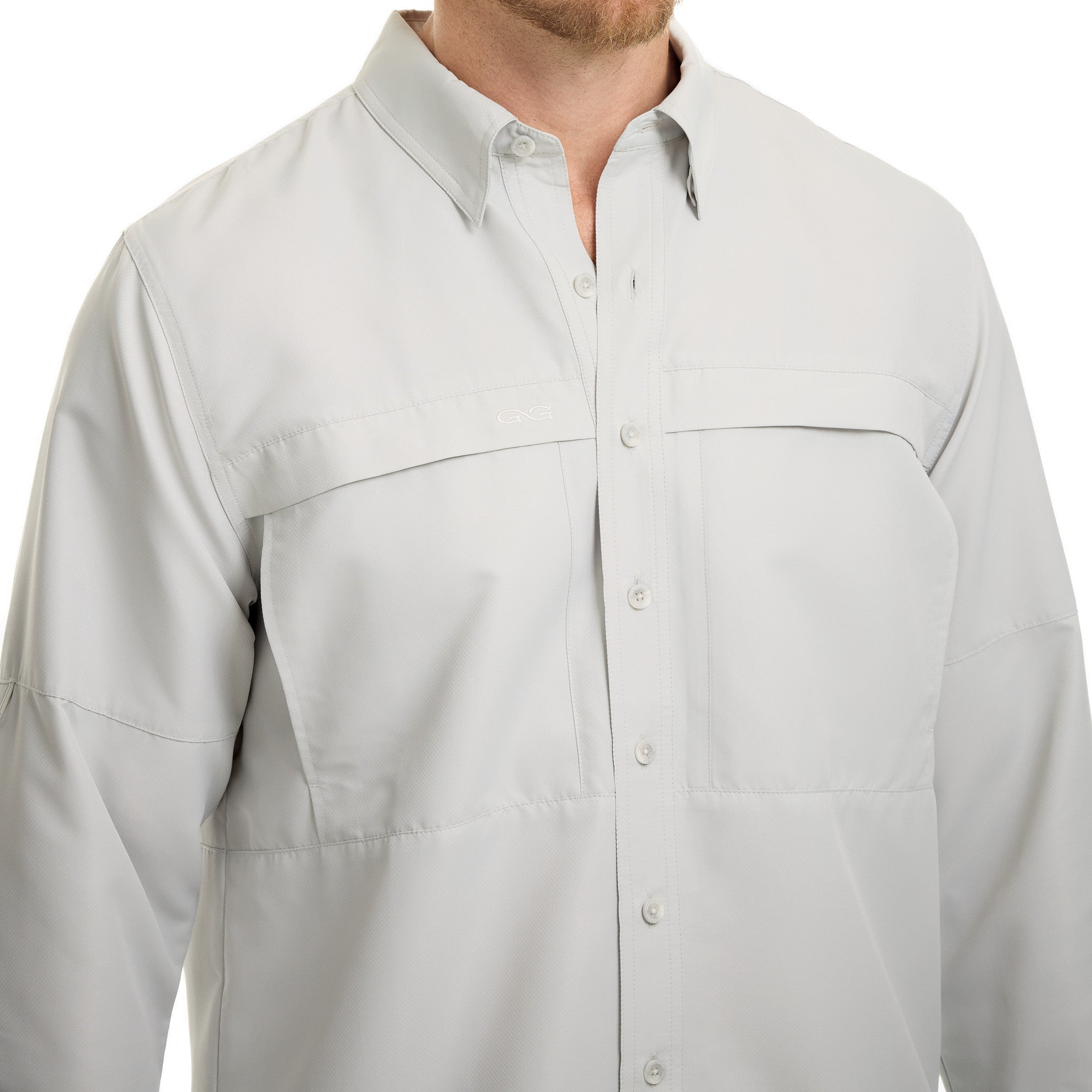 Light gray button-up shirt worn by a person on a white background
