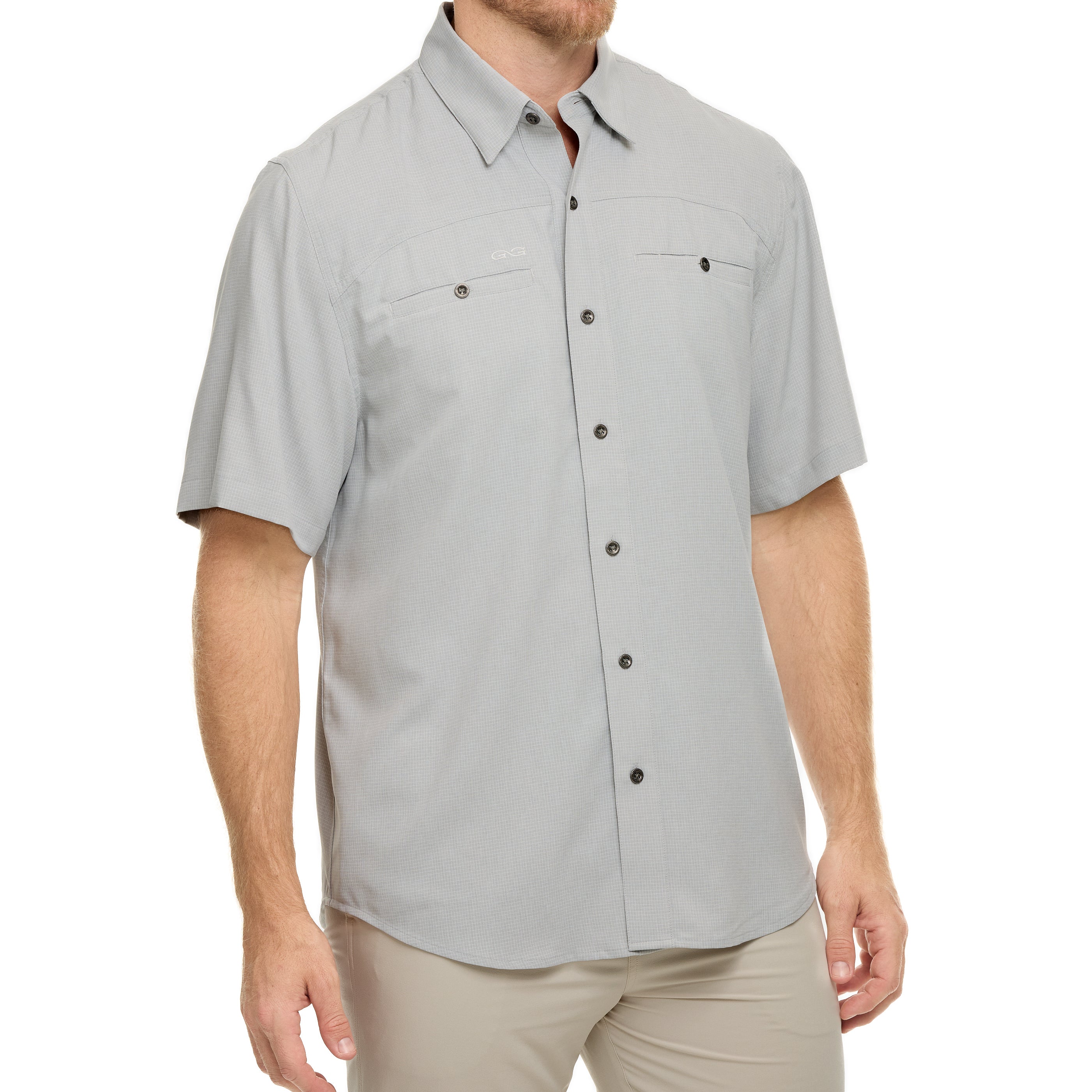 Man wearing a gray short-sleeve button-up shirt on a white background