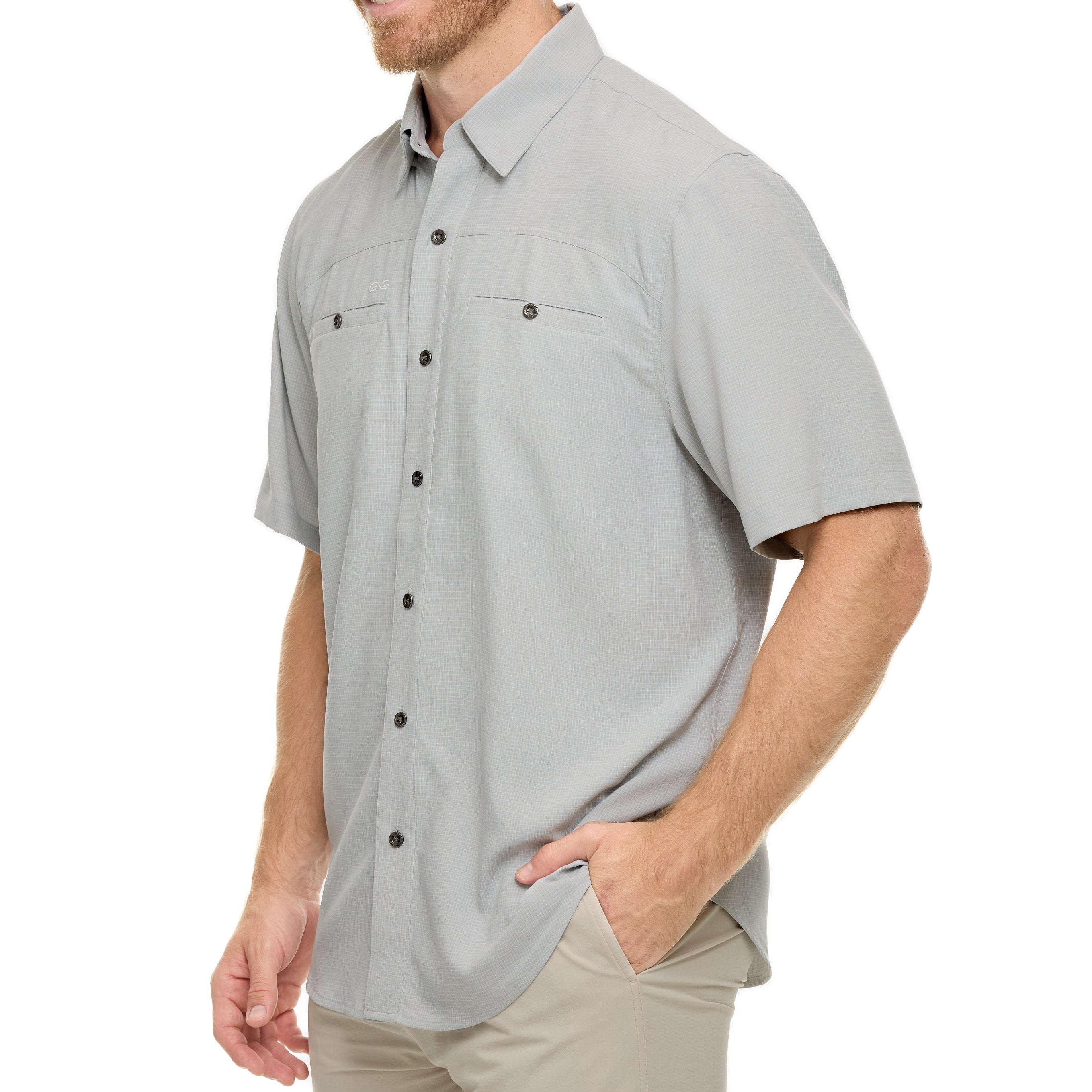 Man wearing a gray short-sleeve button-up shirt on a white background