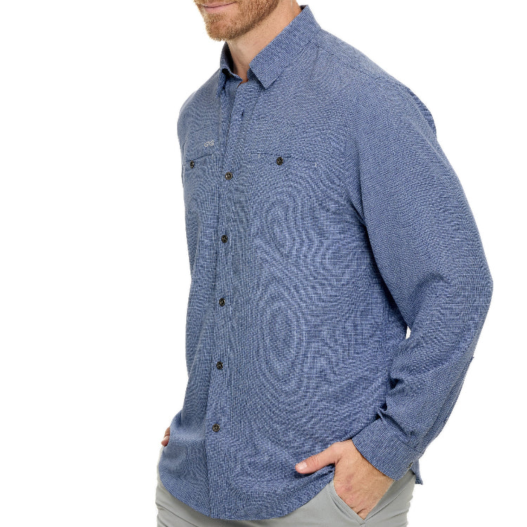 Man wearing a blue patterned shirt on a white background