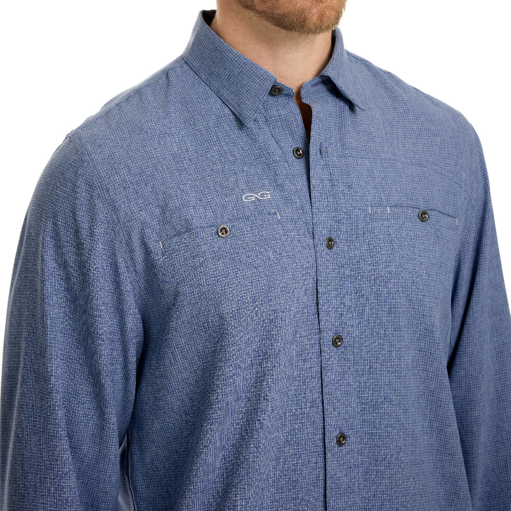 Blue checkered shirt with a brand logo on a white background