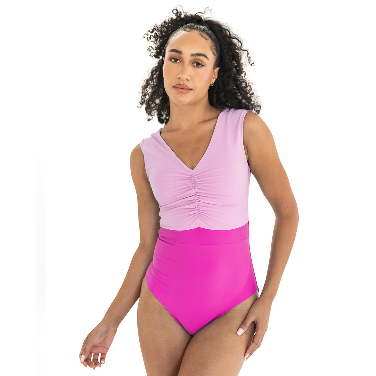 Woman wearing a two-tone pink swimsuit on a white background