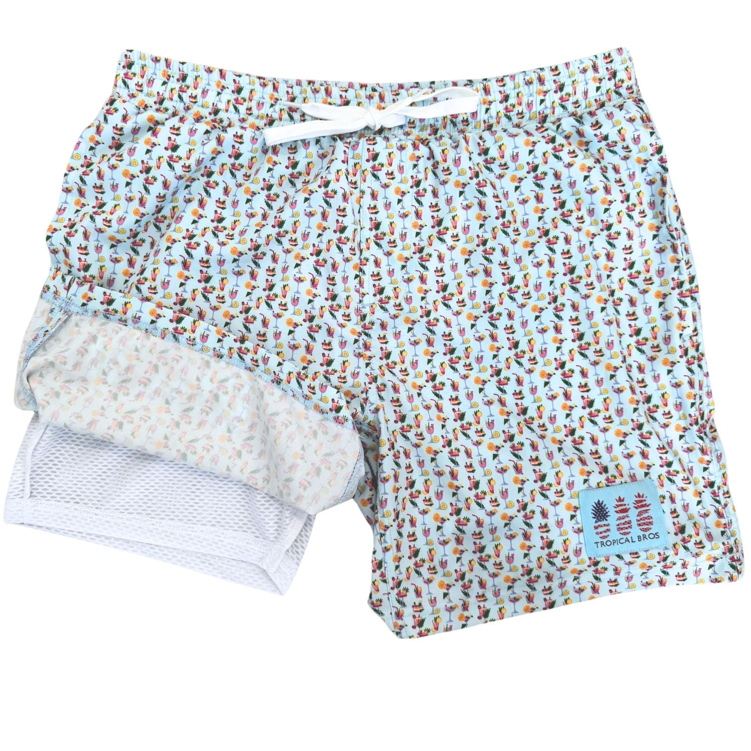 Patterned swim shorts with a visible brand label on a white background
