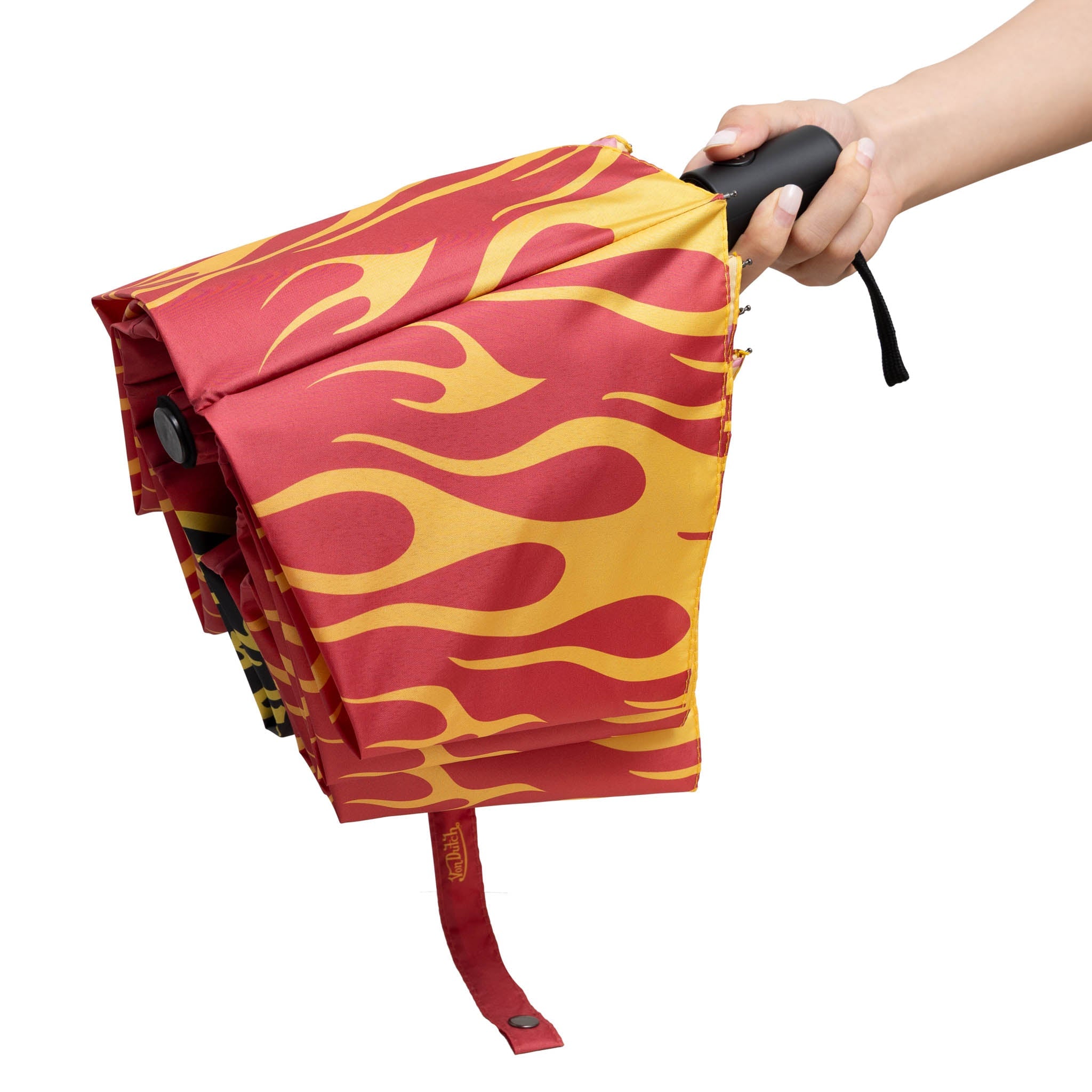 Flame-patterned umbrella held by a hand on a white background