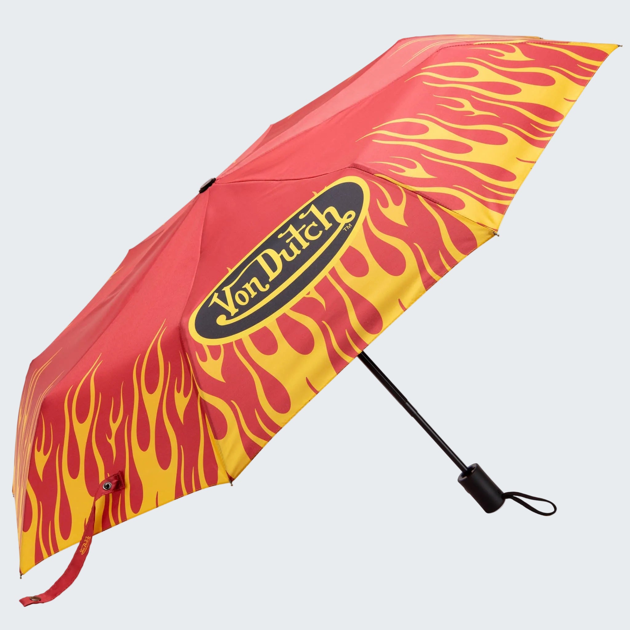 Red and yellow flame-patterned umbrella with 'Von Dutch' logo on a white background