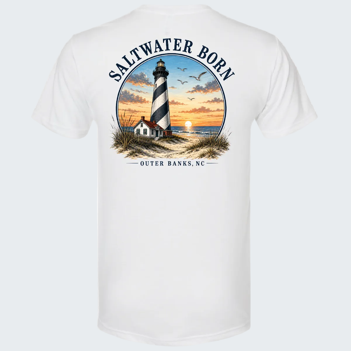 White short-sleeve t-shirt showing the back with a large circular graphic of a lighthouse at sunset, birds, and the text 'SALTWATER BORN' and 'OUTER BANKS, NC'.