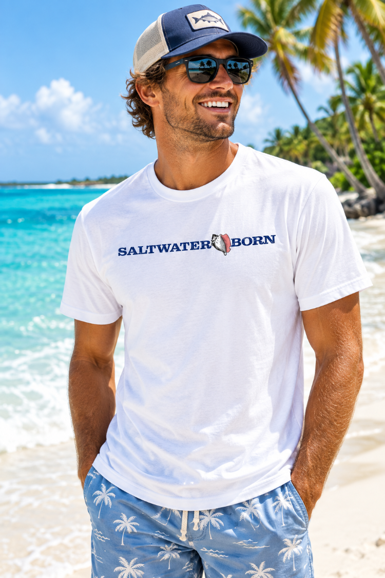 A white short-sleeve crewneck t-shirt with 'SALTWATER BORN' printed across the chest in navy blue text, separated by a salt shell graphic.