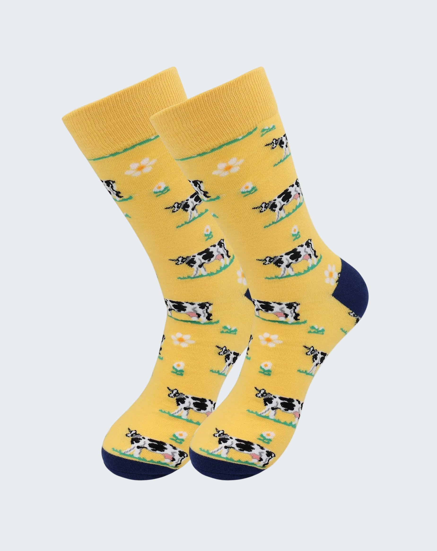 Yellow socks with cow pattern on a white background