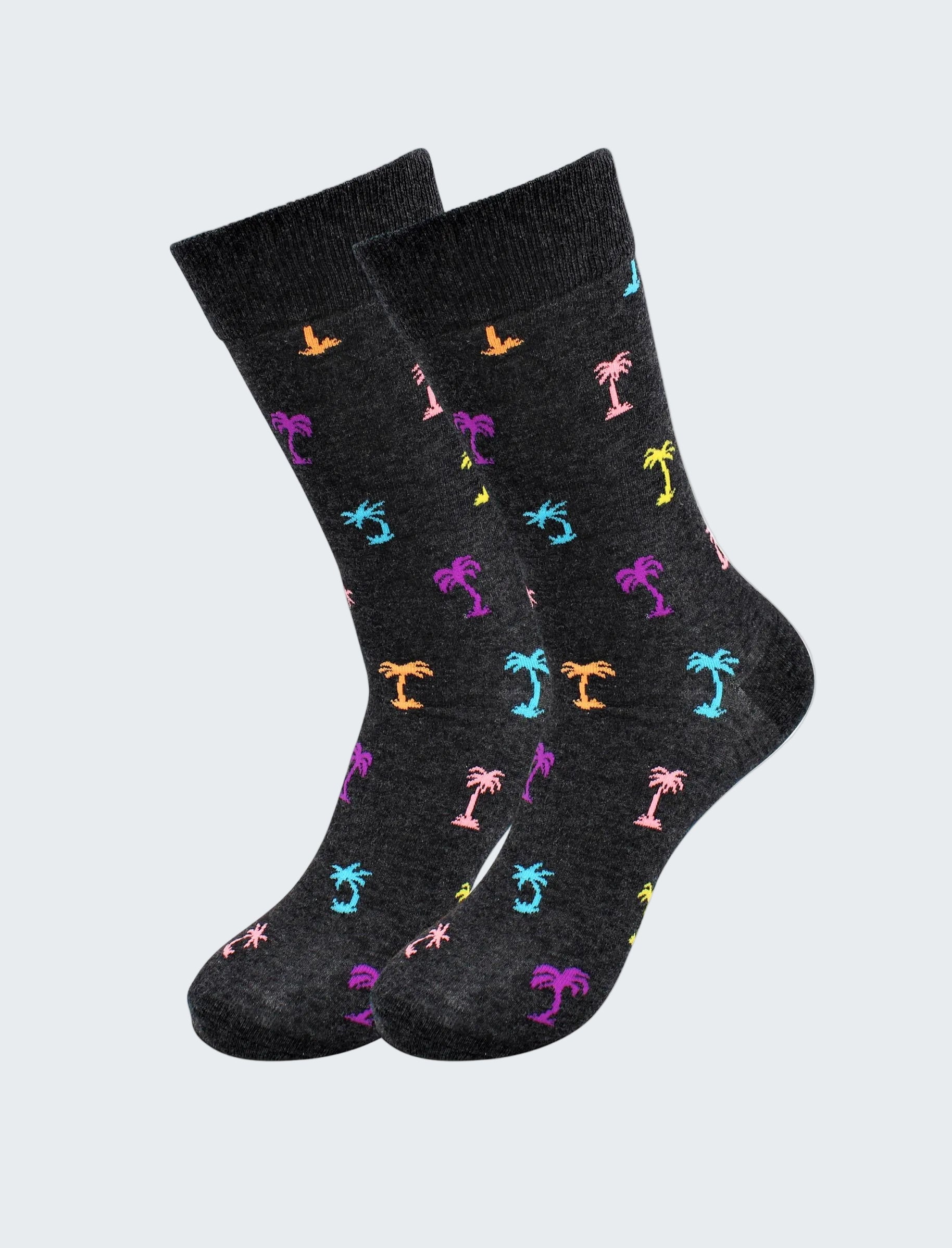 Black socks with colorful palm tree pattern on a white background