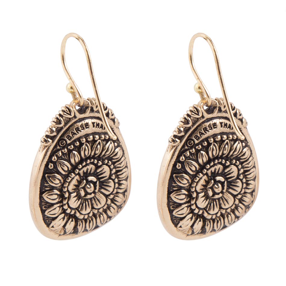Pair of gold-tone floral earrings on a white background