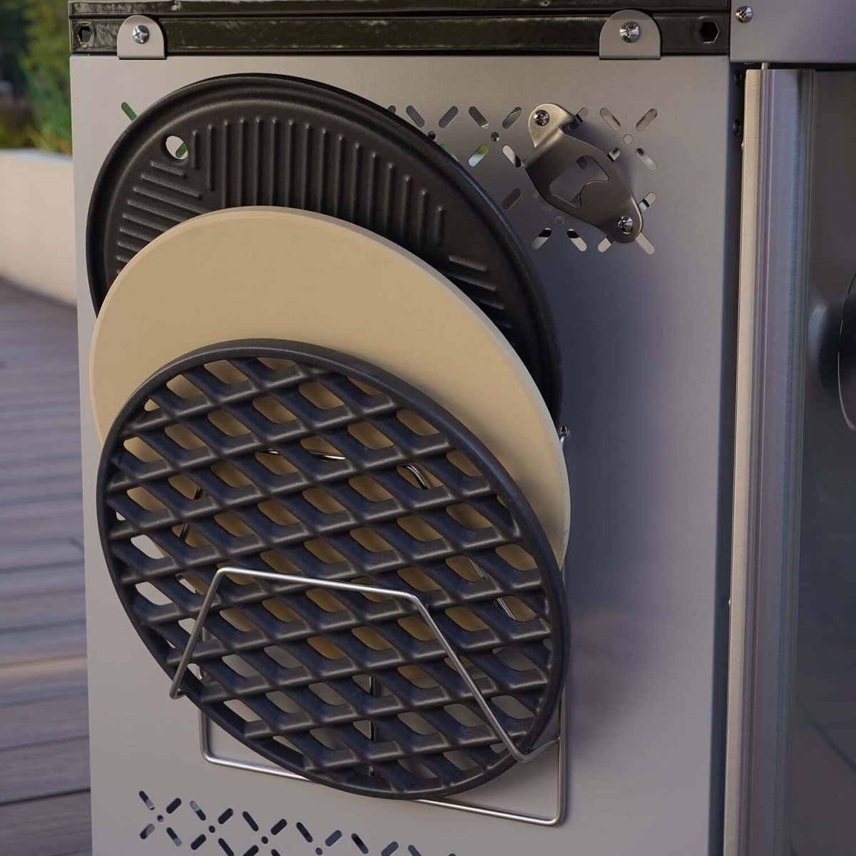 Close-up of a metal appliance with circular grates on a blurred background