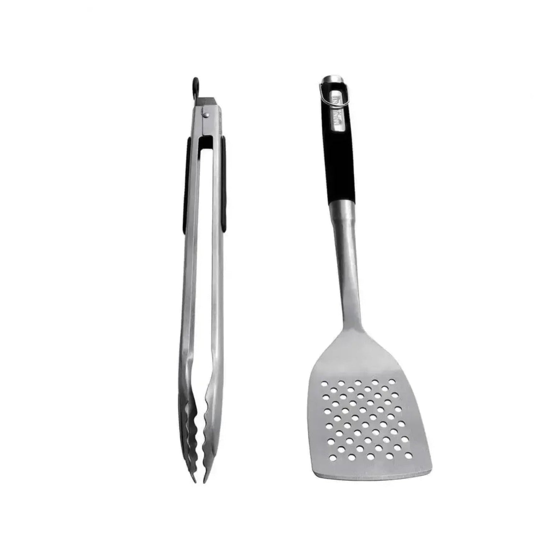 Set of metal tongs and spatula on a white background