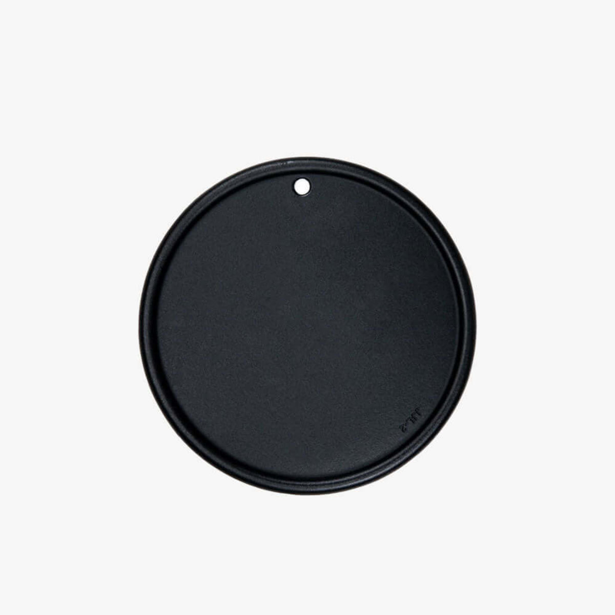 Black round lid on a white background