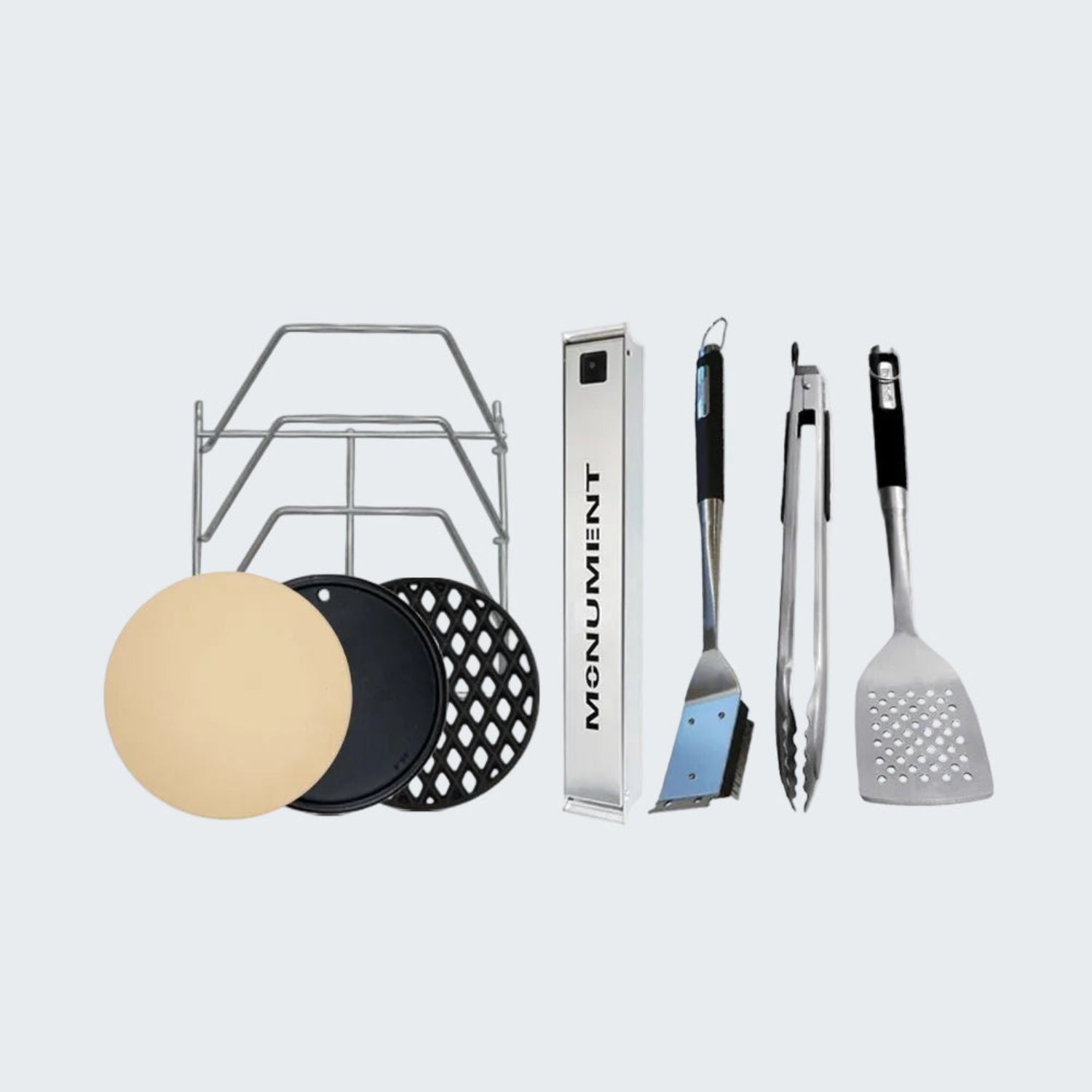Grill accessories including a spatula, tongs, and grill plates on a white background.