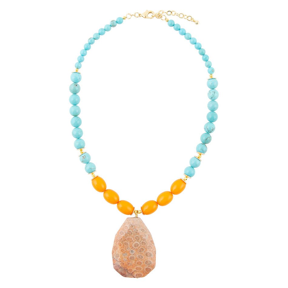 Necklace with turquoise and orange beads and a large brown bead on a white background