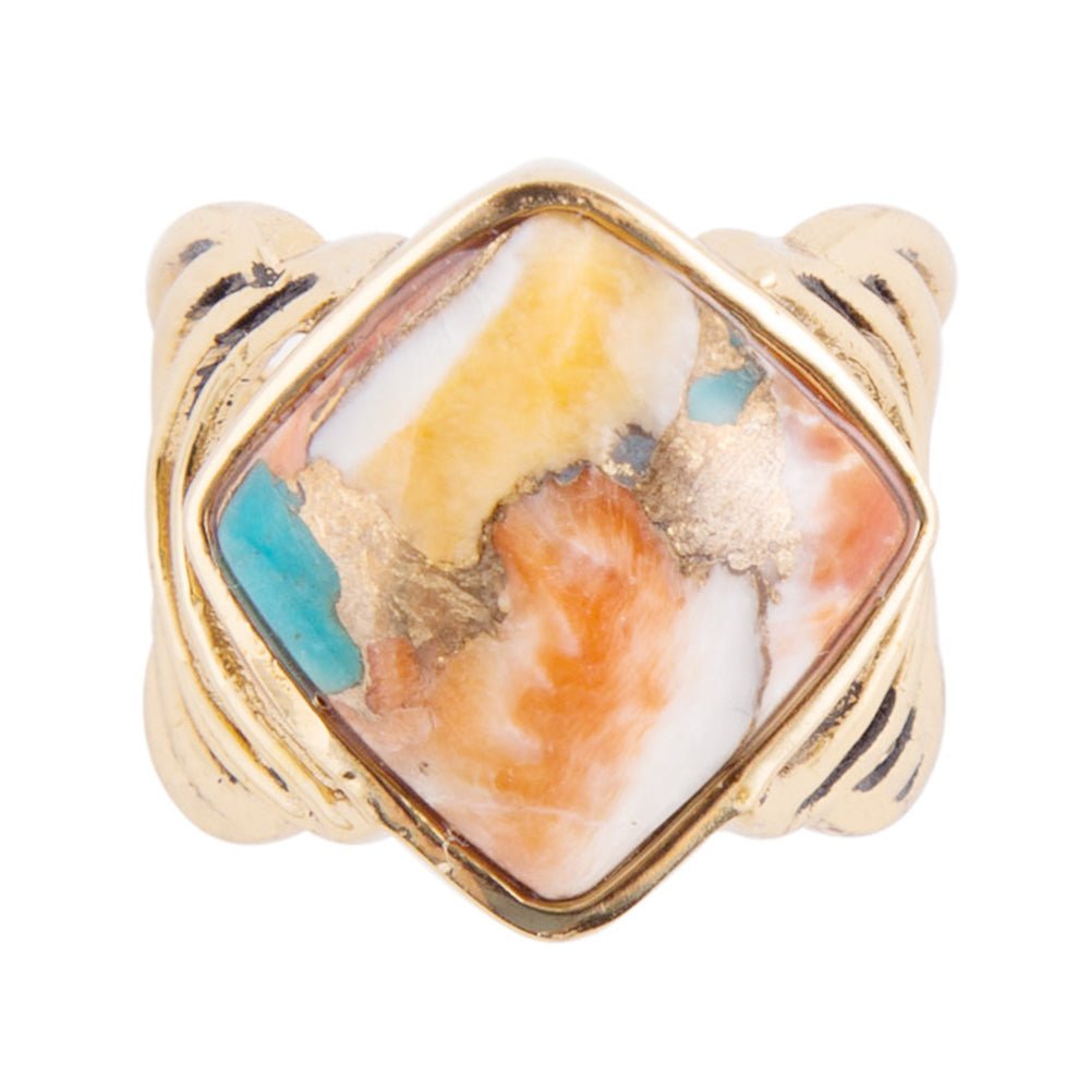 Gold ring with a stone inlay featuring orange, white, and turquoise colors on a white background