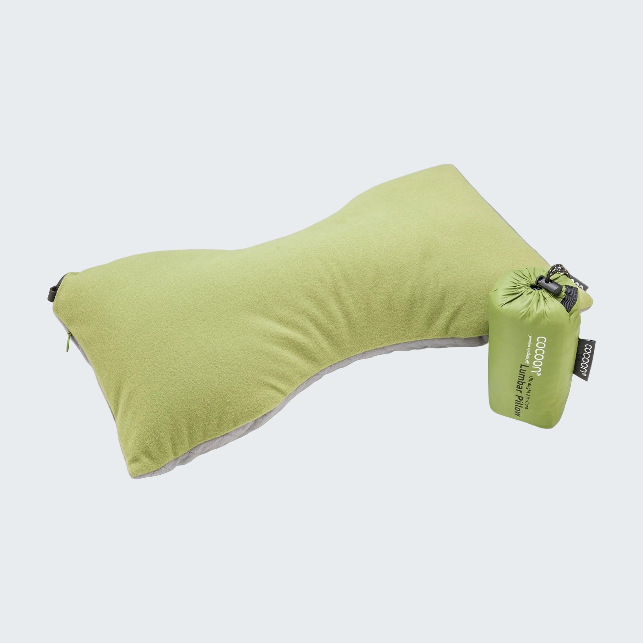 Green travel pillow with a carrying bag on a light gray background