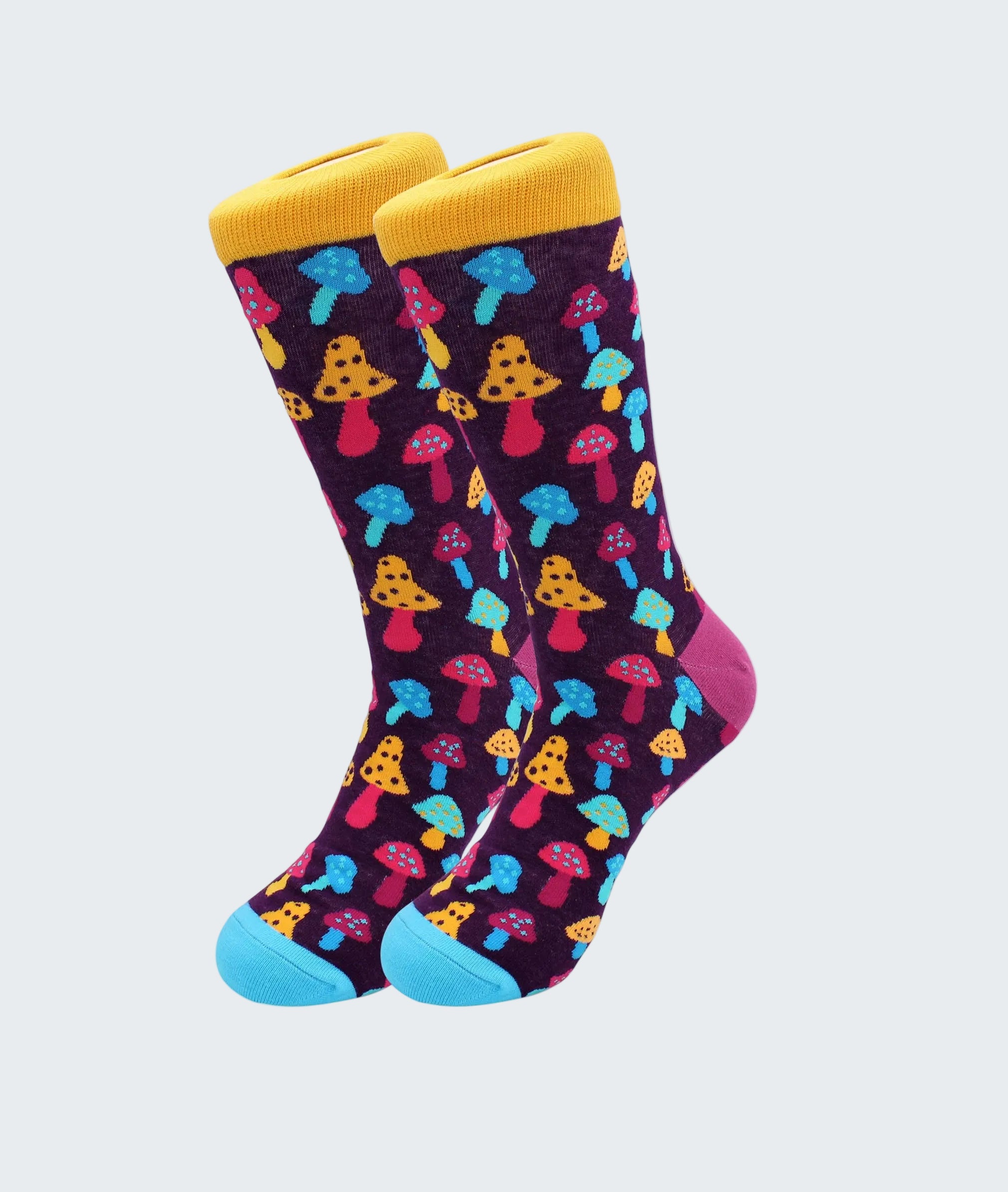 Colorful mushroom-patterned socks with yellow cuffs and blue toes on a white background