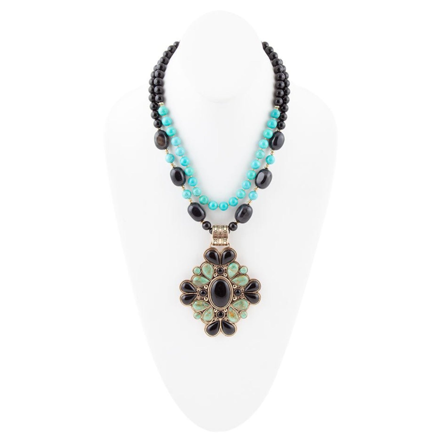 Necklace with black and turquoise beads and a decorative pendant on a white background