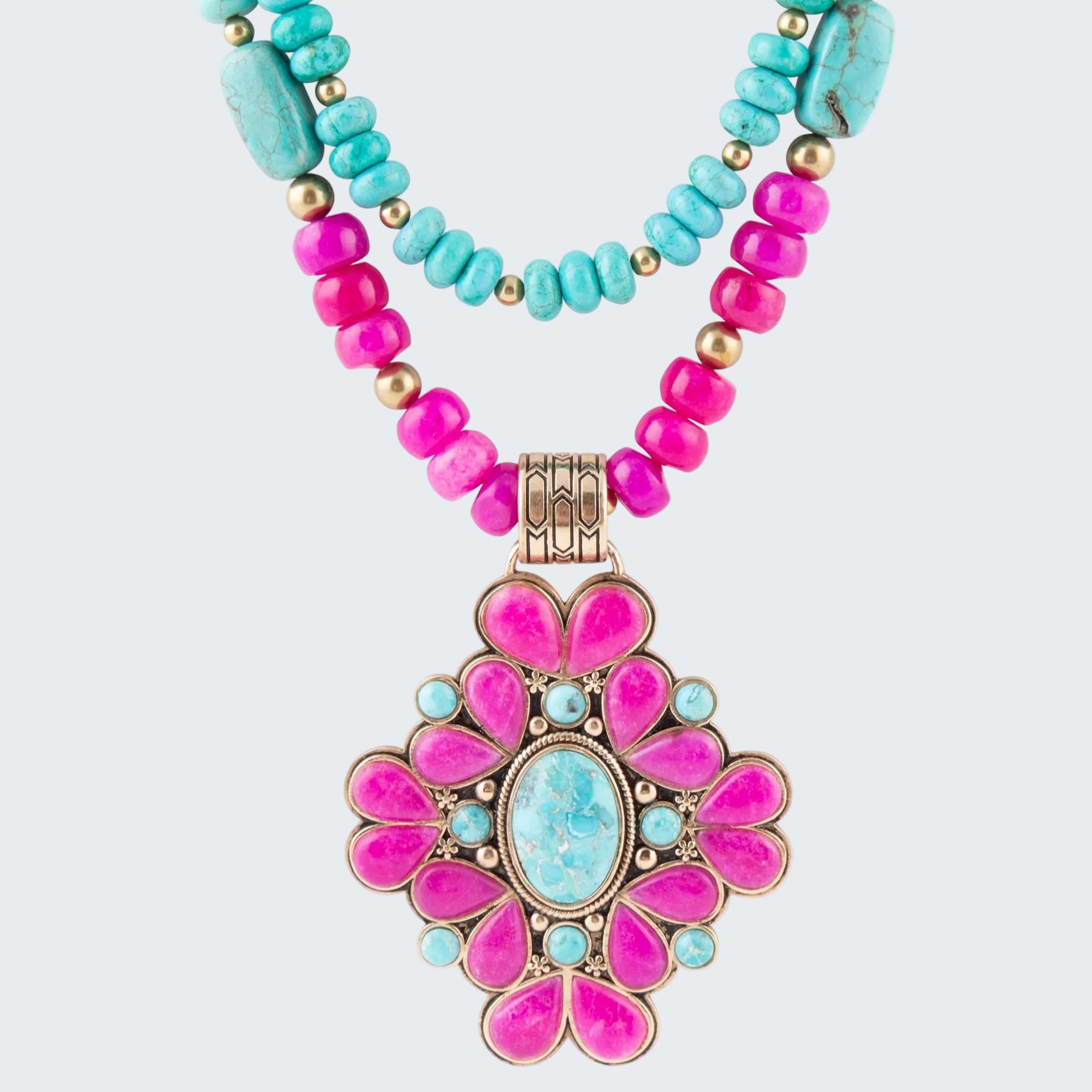 Necklace with pink and turquoise beads and a large pink and blue pendant on a white background