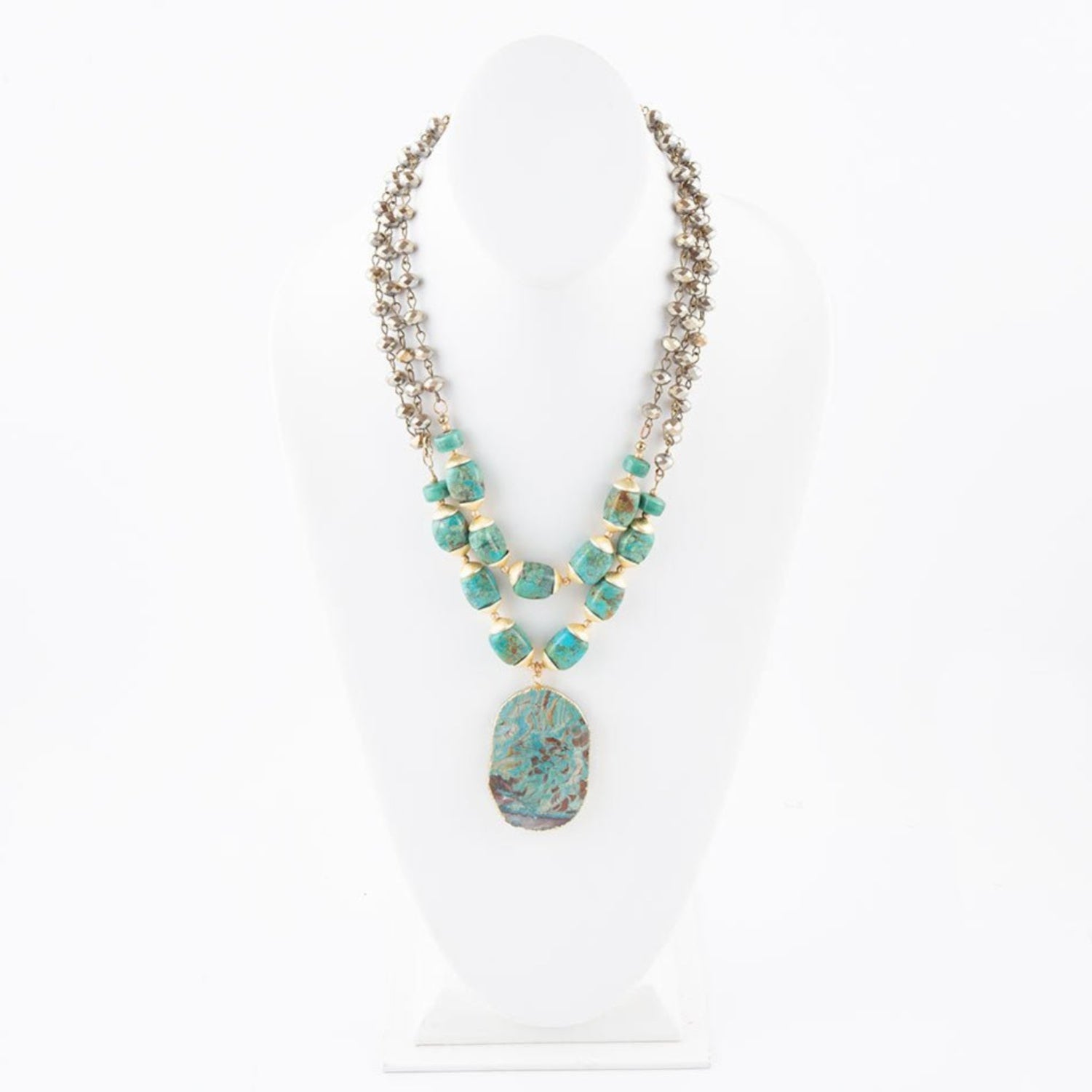Necklace with turquoise beads and pendant on a white background