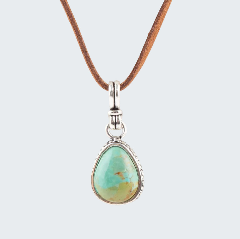 Necklace with a turquoise pendant on a white background