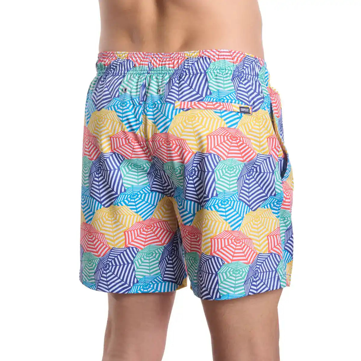 Colorful geometric patterned swim shorts on a white background
