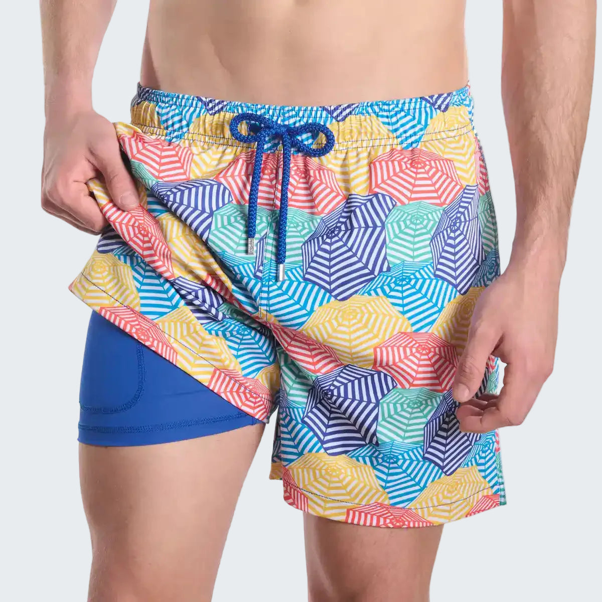 Colorful geometric patterned swim shorts with a blue drawstring on a white background
