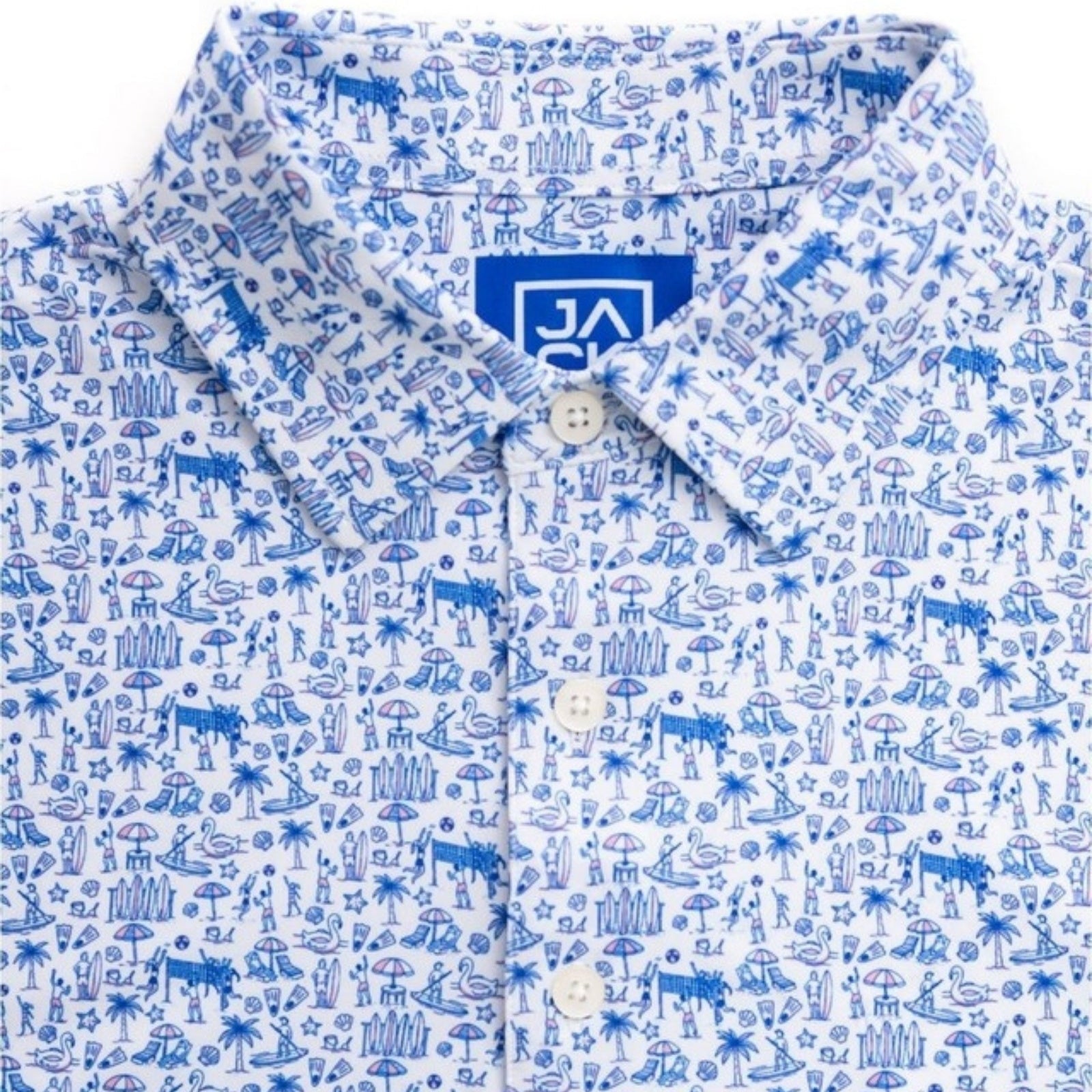 A close-up of a short-sleeve button-up shirt with a white base and a blue all-over tropical beach-themed print, featuring a collar and a visible J.A.
