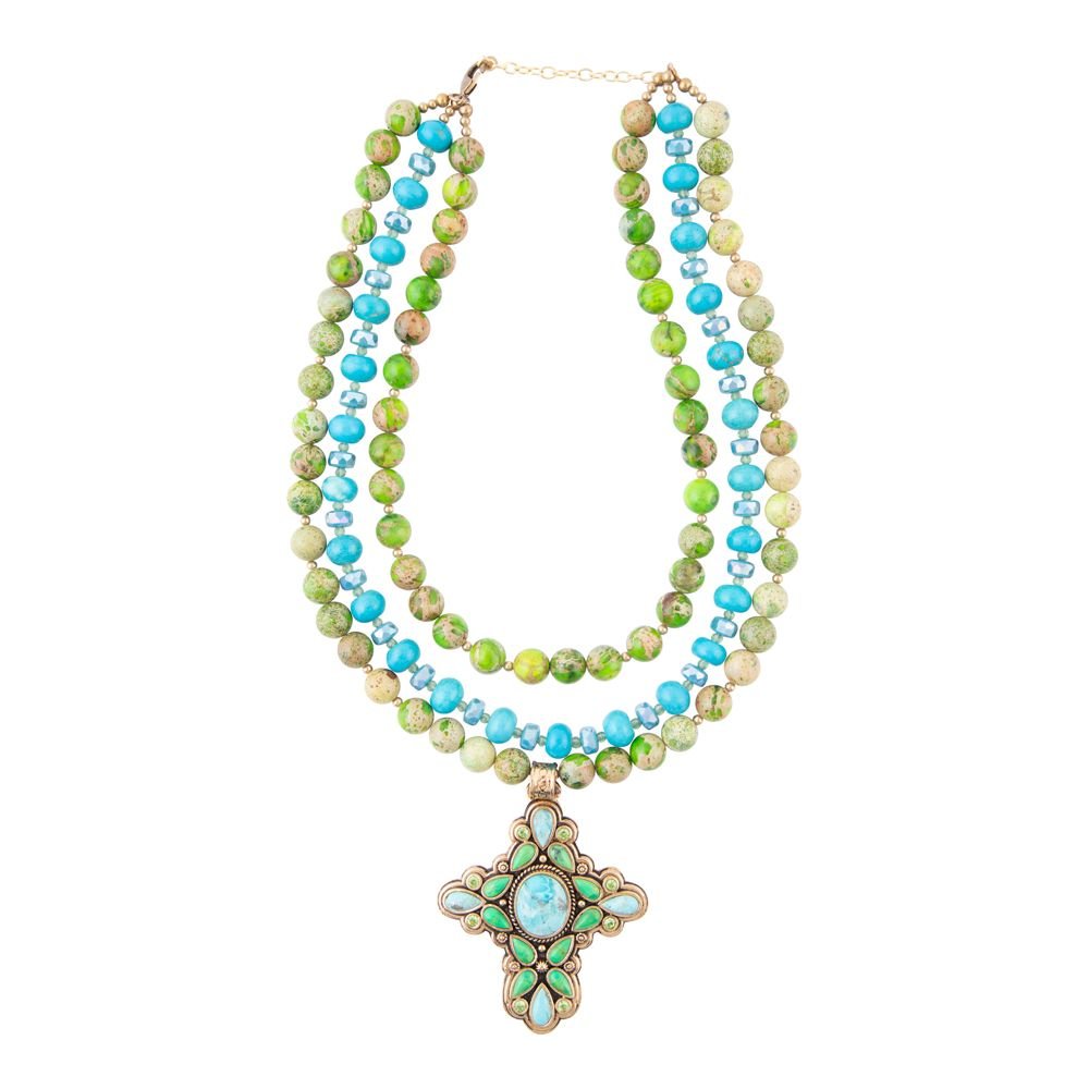 Multistrand beaded necklace with a decorative clasp on a white background