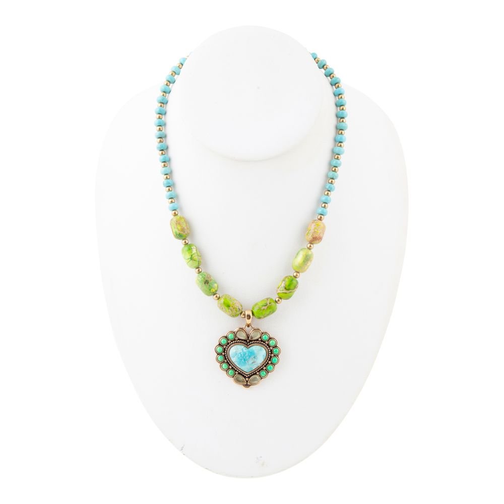 Necklace with heart-shaped pendant on a white mannequin bust