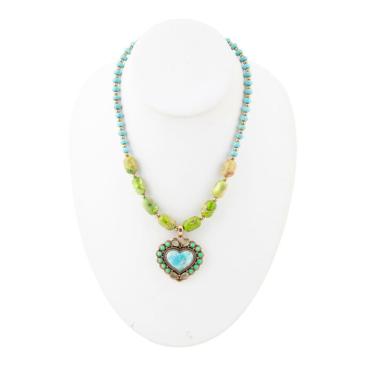 Necklace with heart-shaped pendant on a white mannequin bust