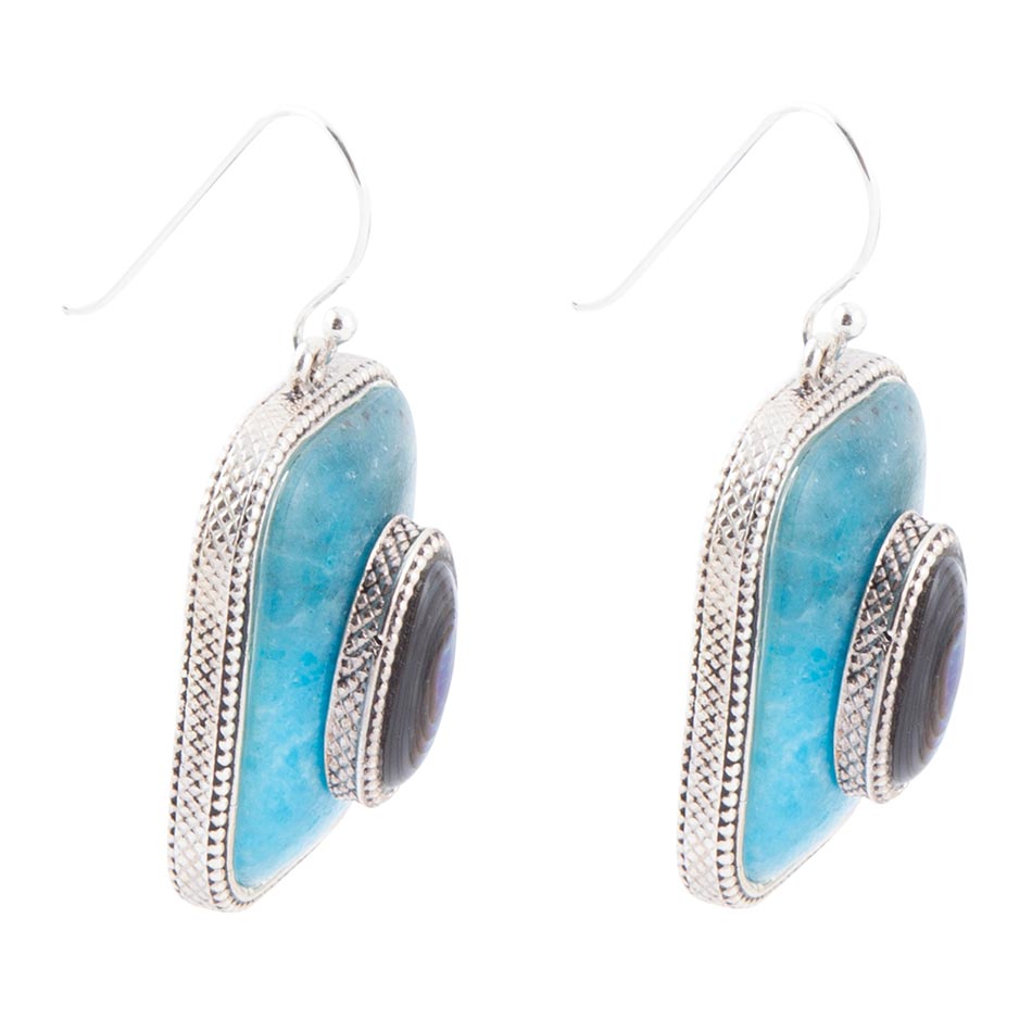 Pair of earrings with blue stones and silver accents on a white background
