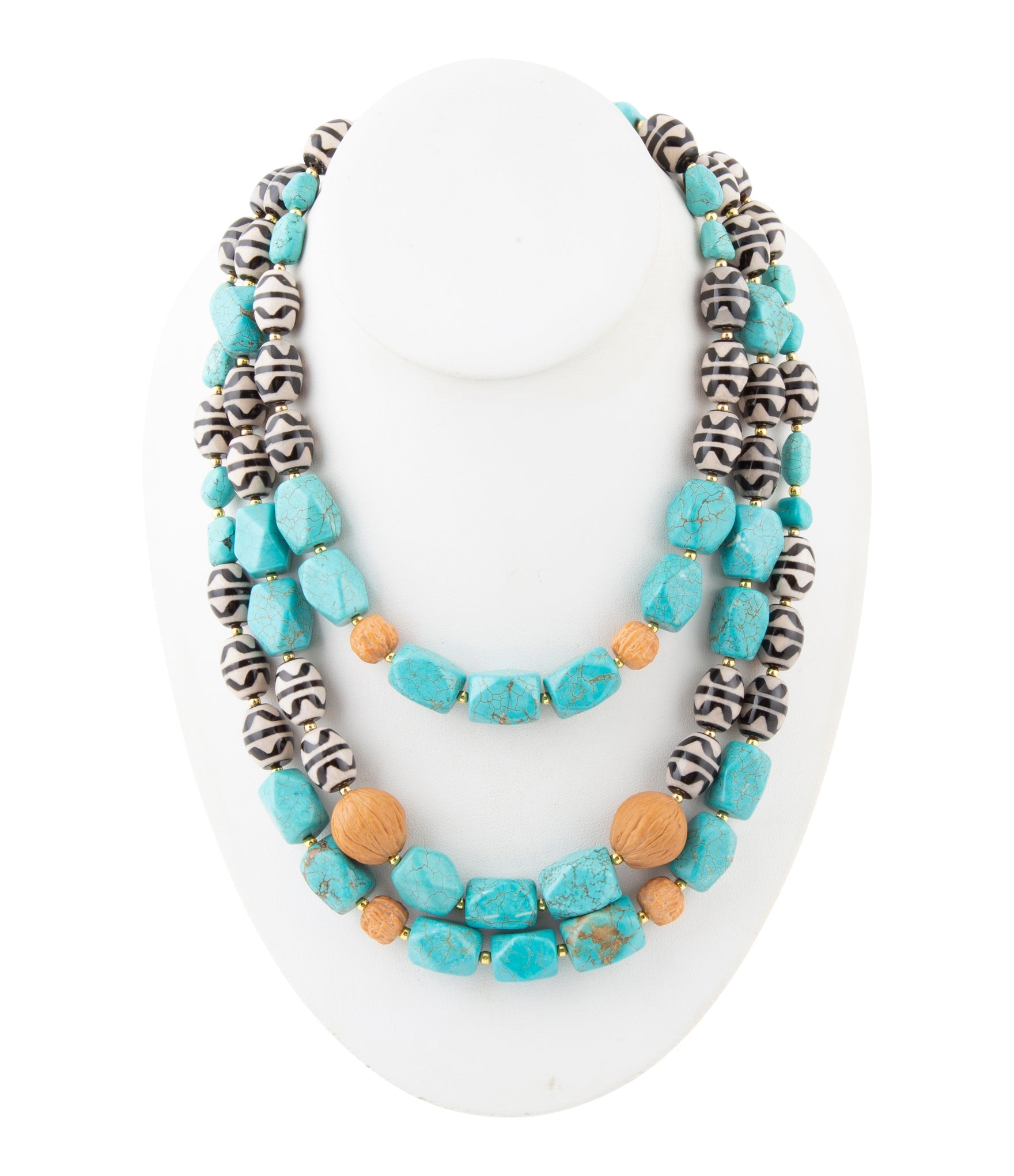 Multistrand necklace with turquoise and orange beads on a white background