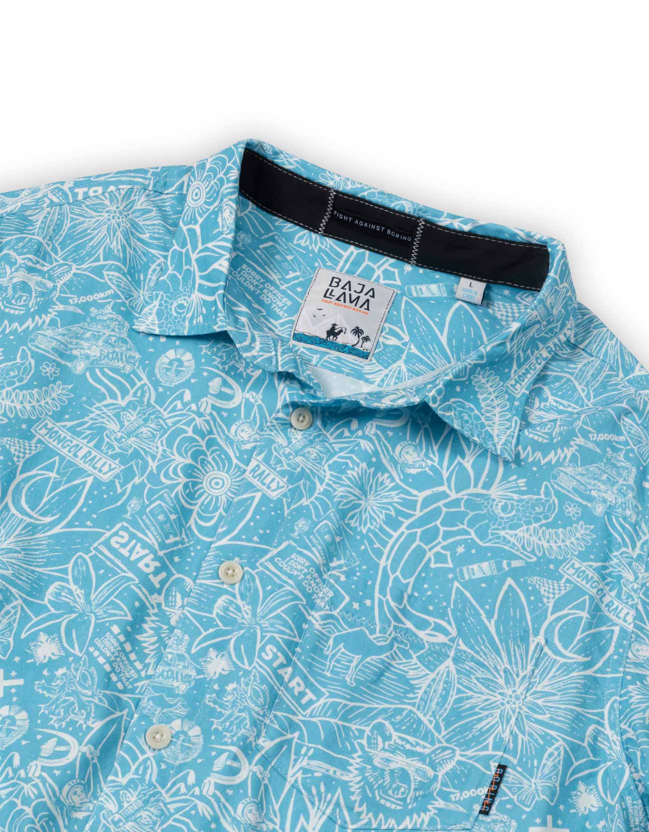 A close-up of a light blue short-sleeve button-up shirt with a white tropical line-art print, featuring a visible Baza Baza brand label at the collar.