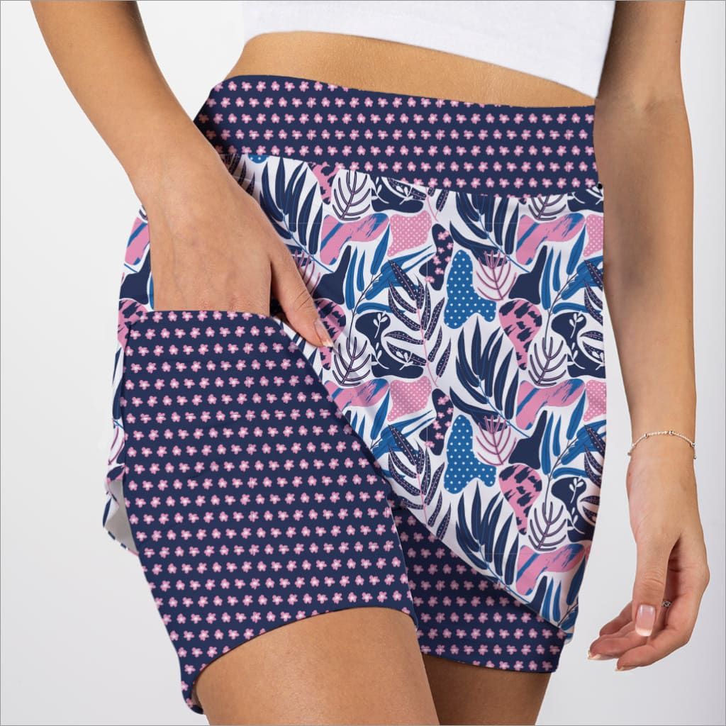 Shorts with a mix of polka dot and leaf pattern on a plain background