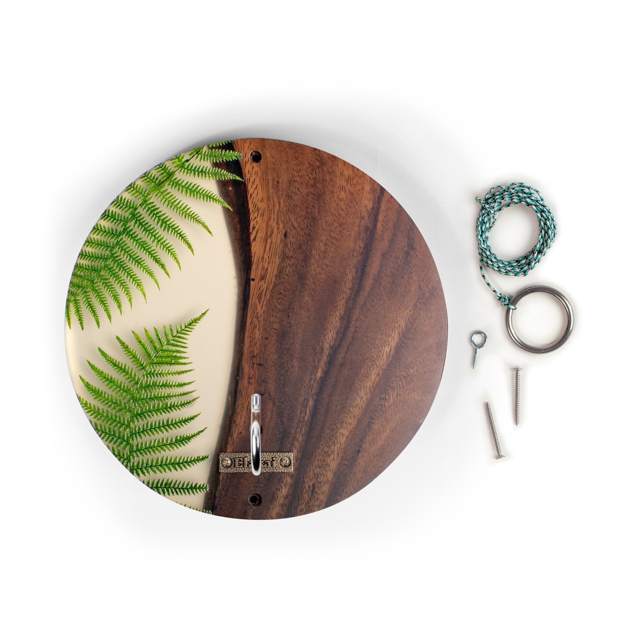 Round wooden wall hook with a split design featuring green fern leaves on one side and a dark brown wood grain on the other, shown with mounting hardware on a white background.